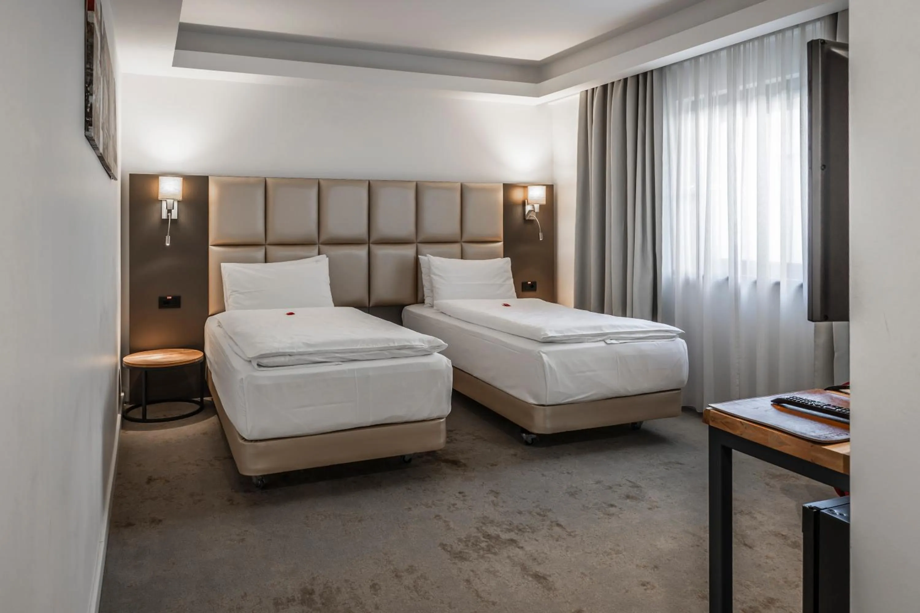 Bed in Charm Boutique Hotel