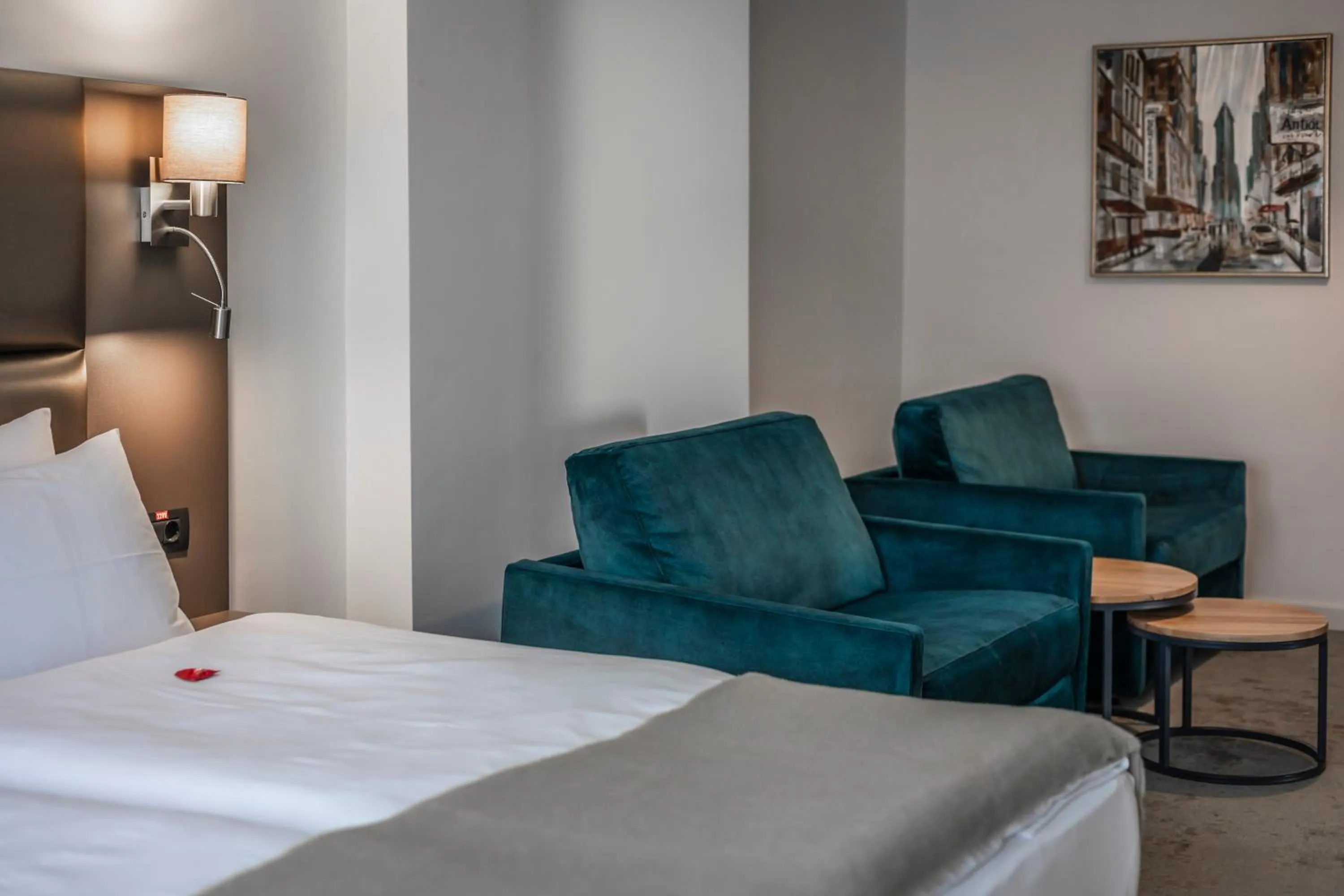 Seating area, Bed in Charm Boutique Hotel