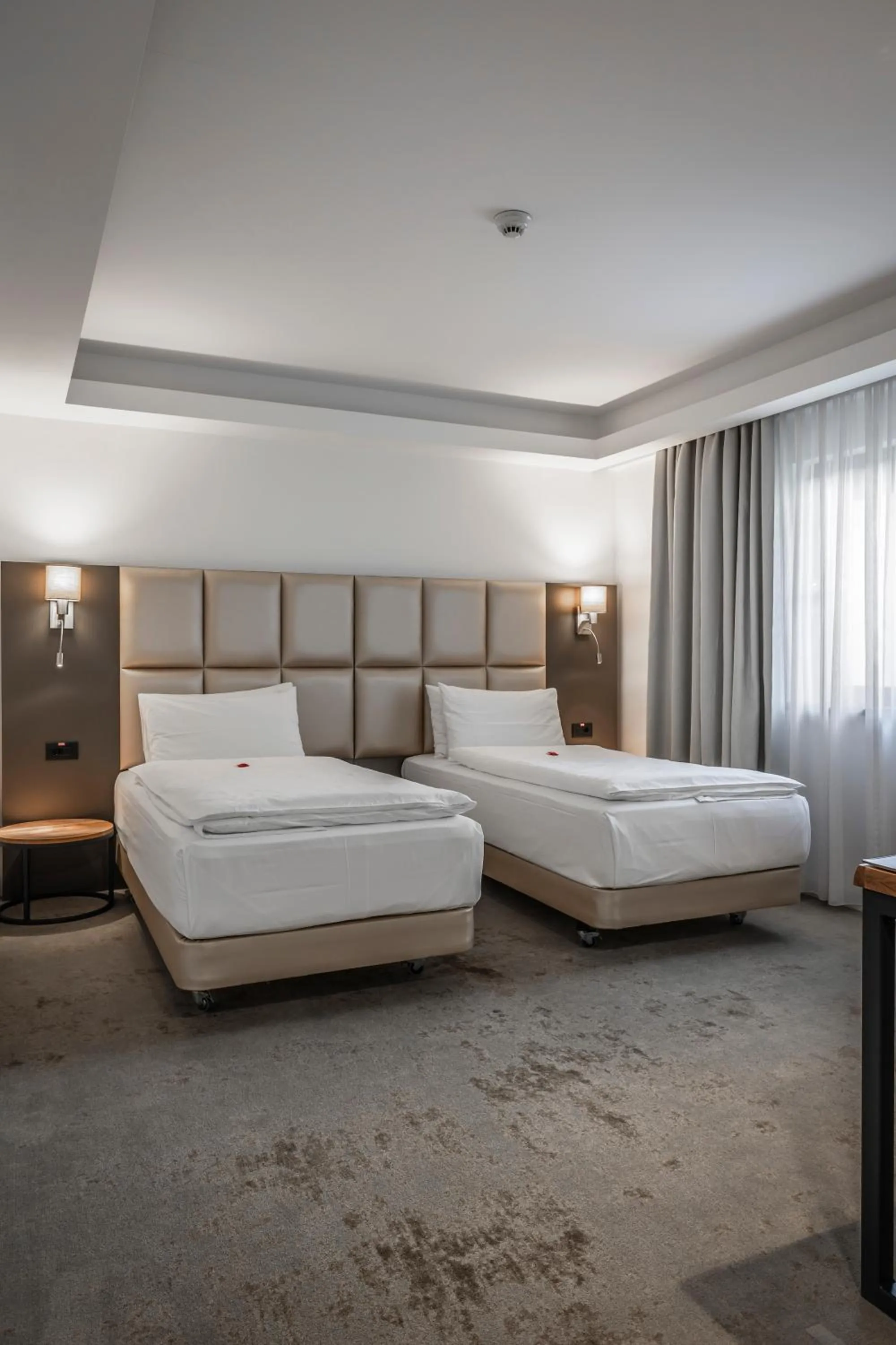 Bed in Charm Boutique Hotel