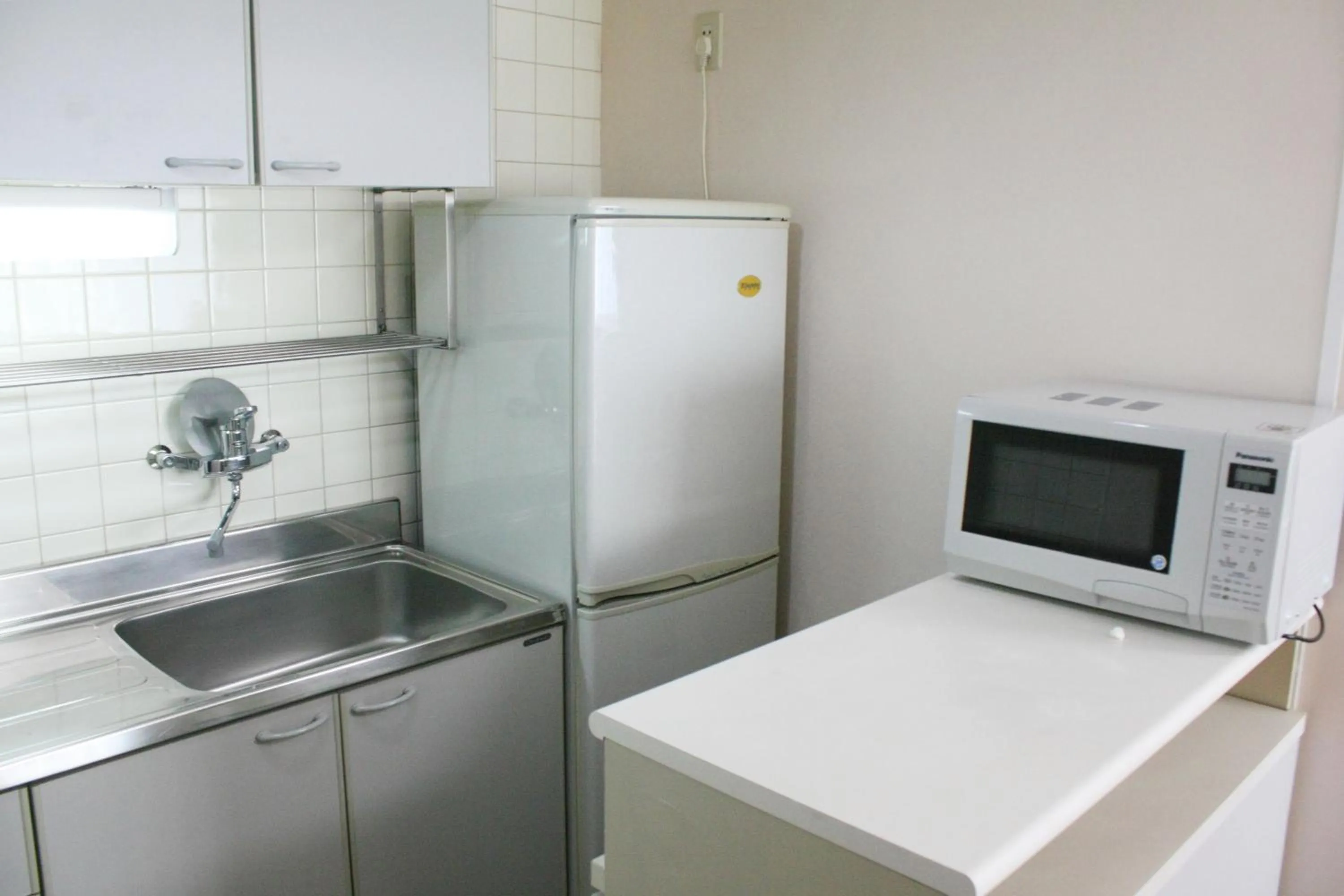 Kitchen or kitchenette in Ruishi Hotel Dalian