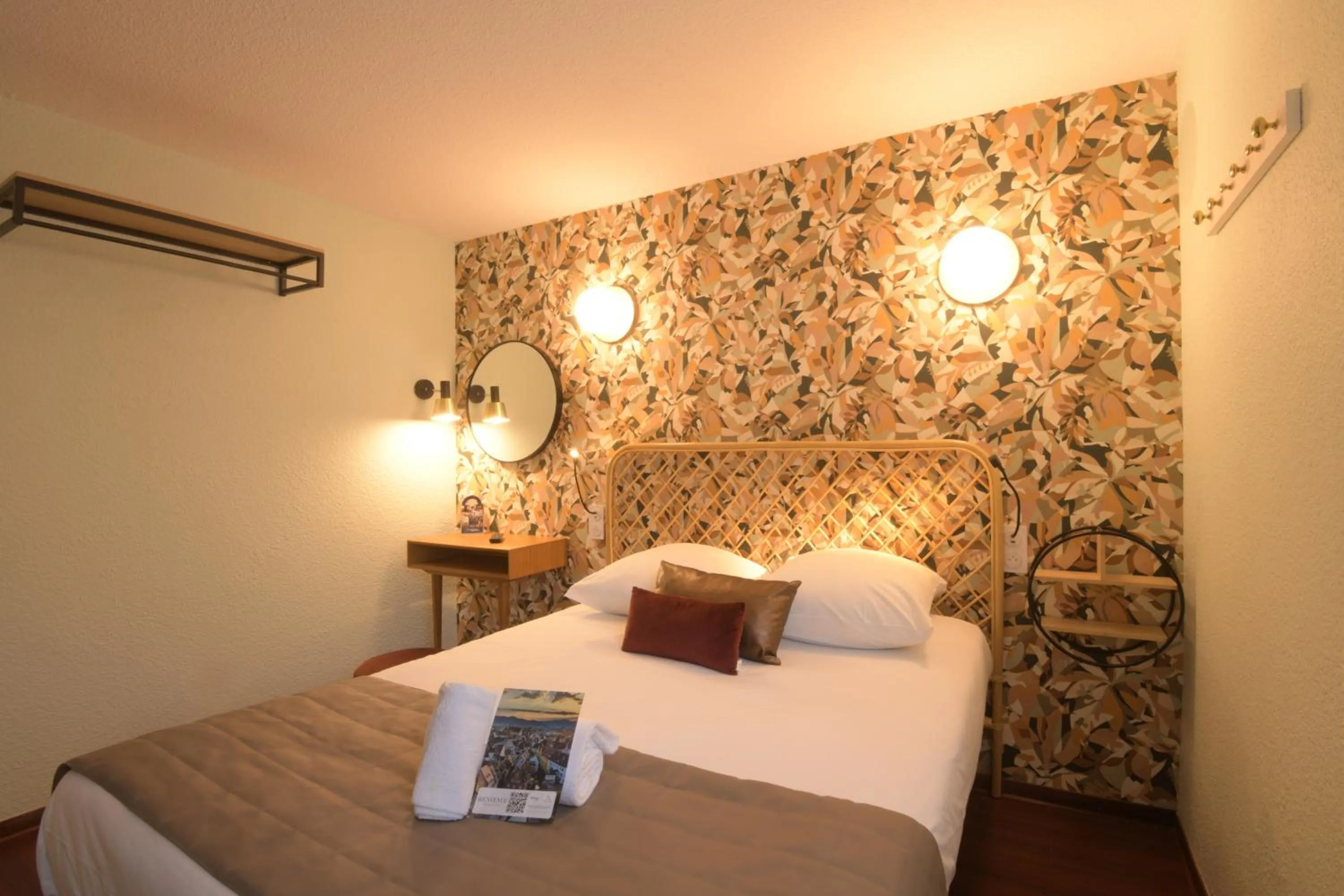 View (from property/room), Bed in Hotel Arc-En-Ciel Colmar Contact Hotel