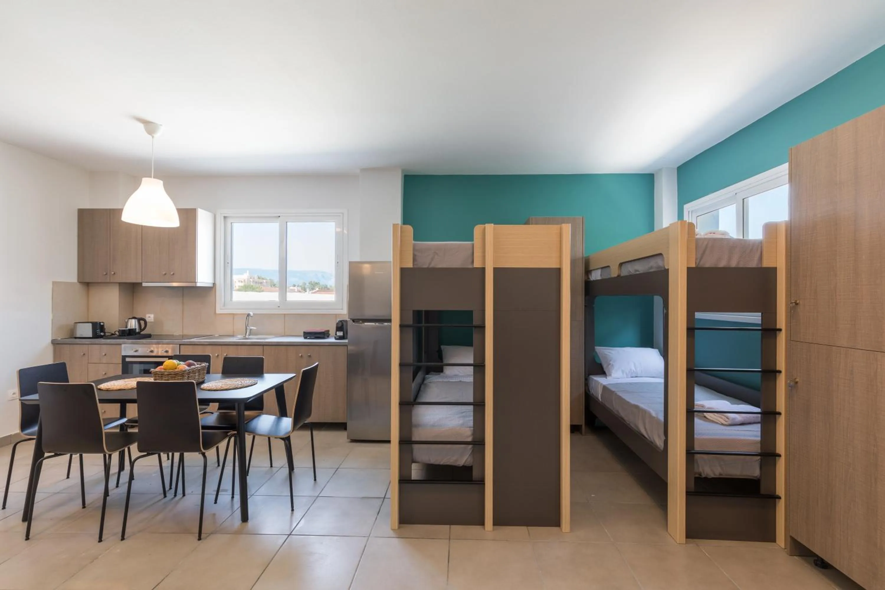 Kitchen or kitchenette, Bed in Local Hostel & Suites