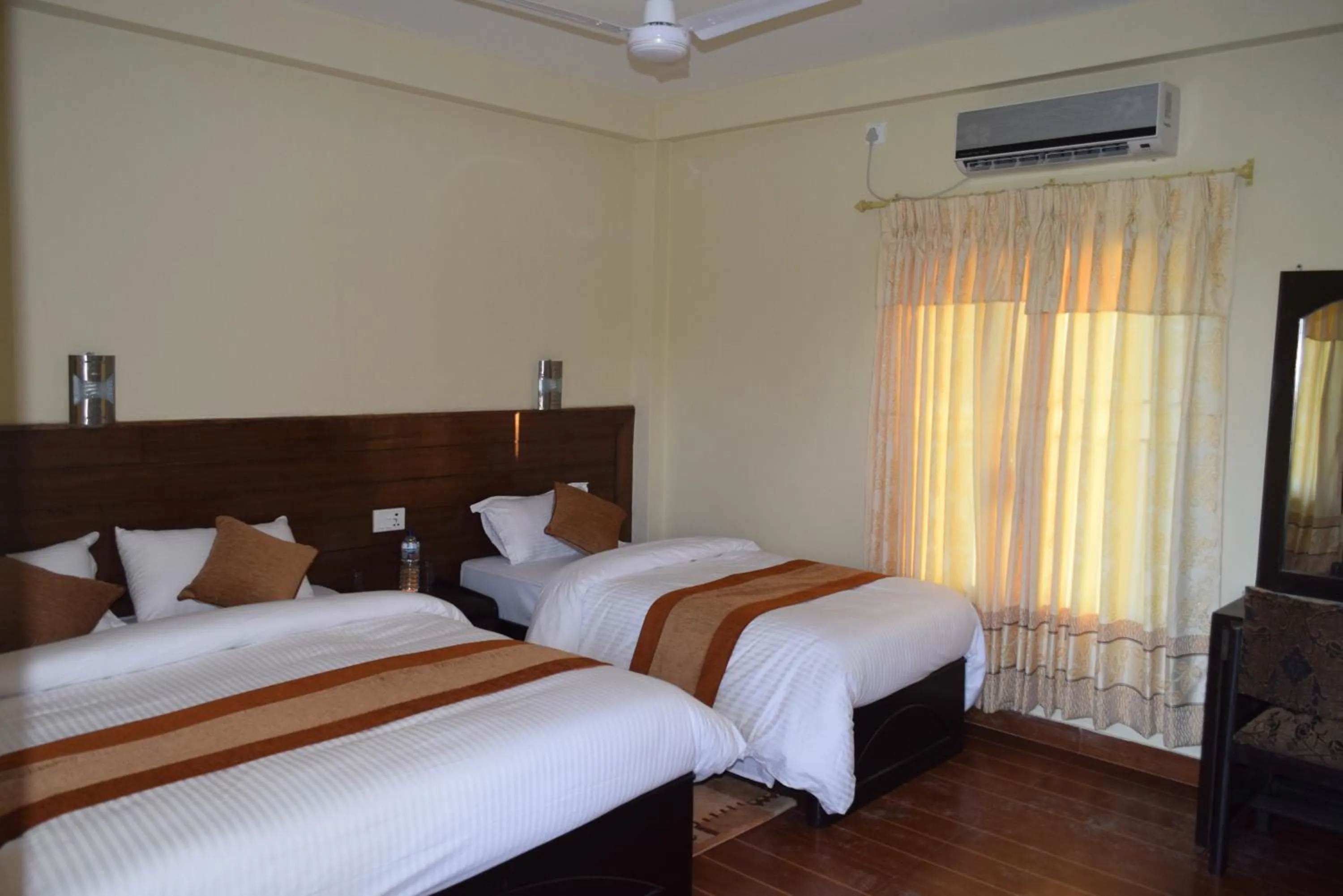 Bed in Chitwan Village Resort