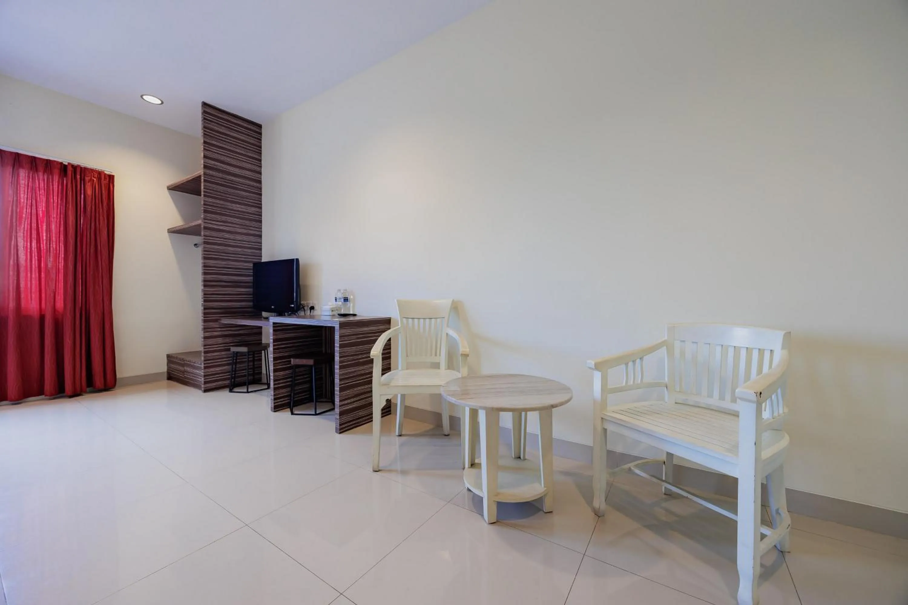 Seating area in RedDoorz Plus near Ferry Terminal Batam Center