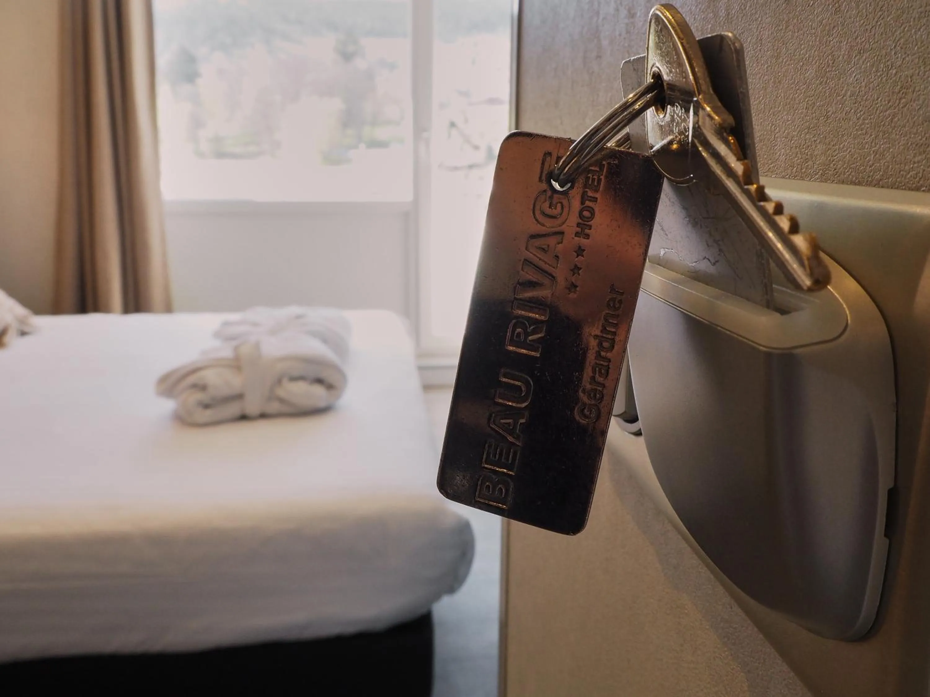 Property logo or sign, Bed in Hôtel Beau Rivage