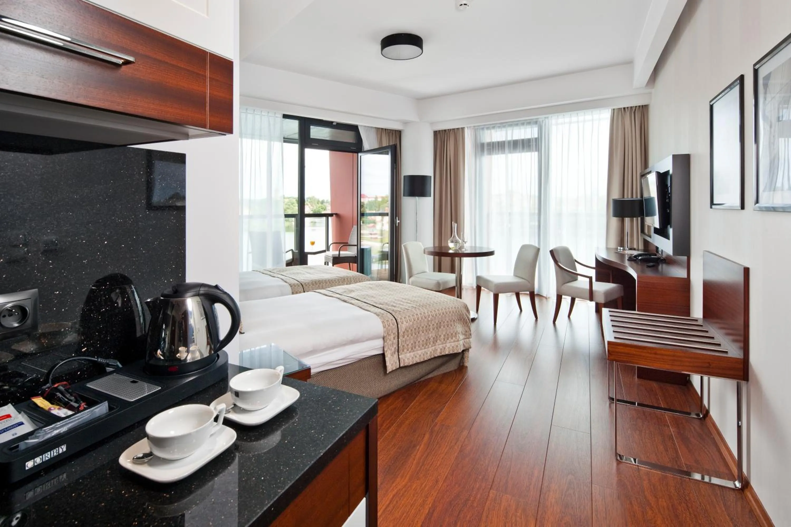 Kitchen or kitchenette, Bed in Hotel Mikołajki Leisure & SPA - Destigo Hotels