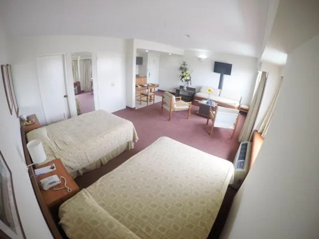 Bed in Hotel Cristina Suites