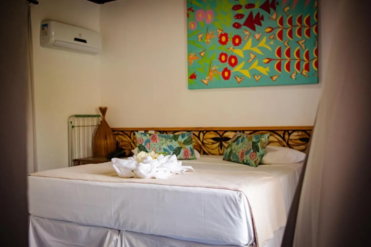 Bed in Pousada Vira Canoa