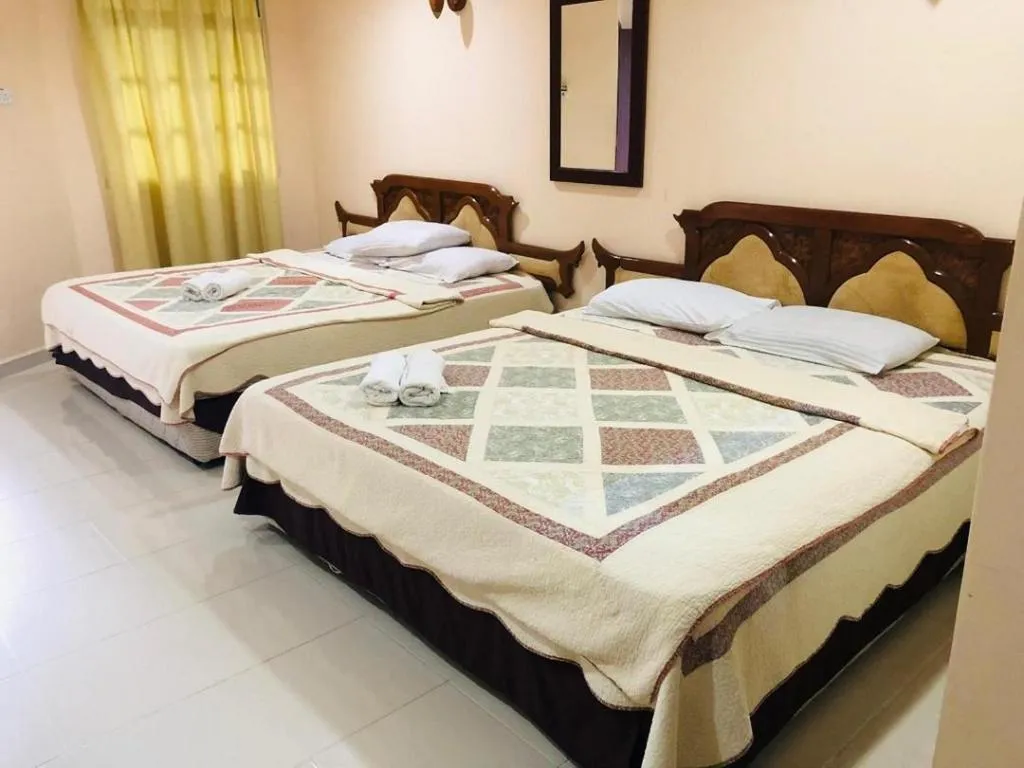 Bed in Penarak Bamboo Beach Motel