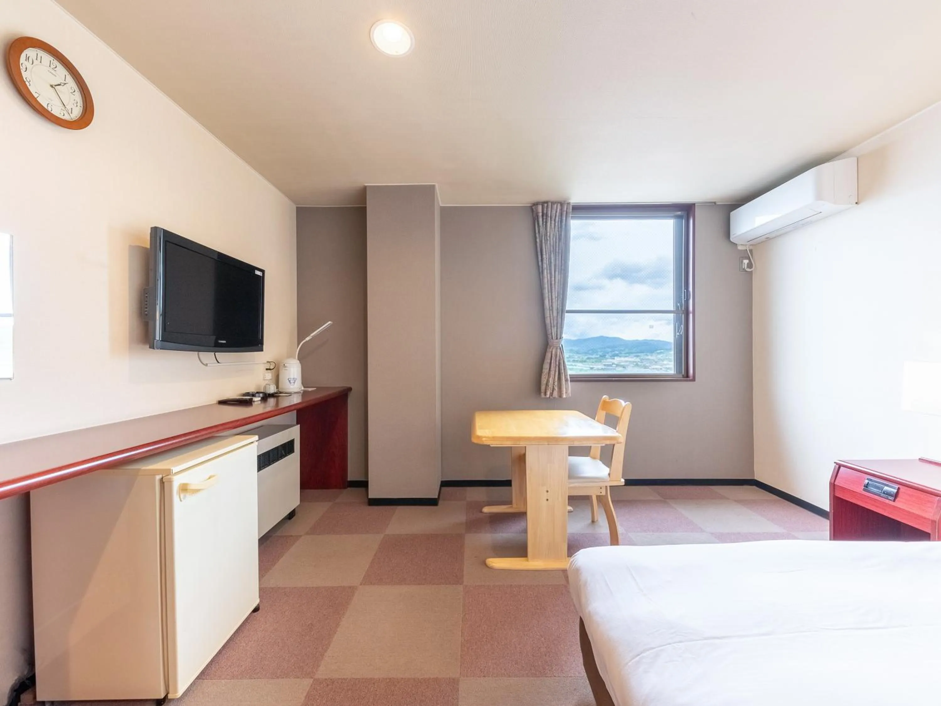 Bed in Tabist Travel Inn Shinshu Nakano