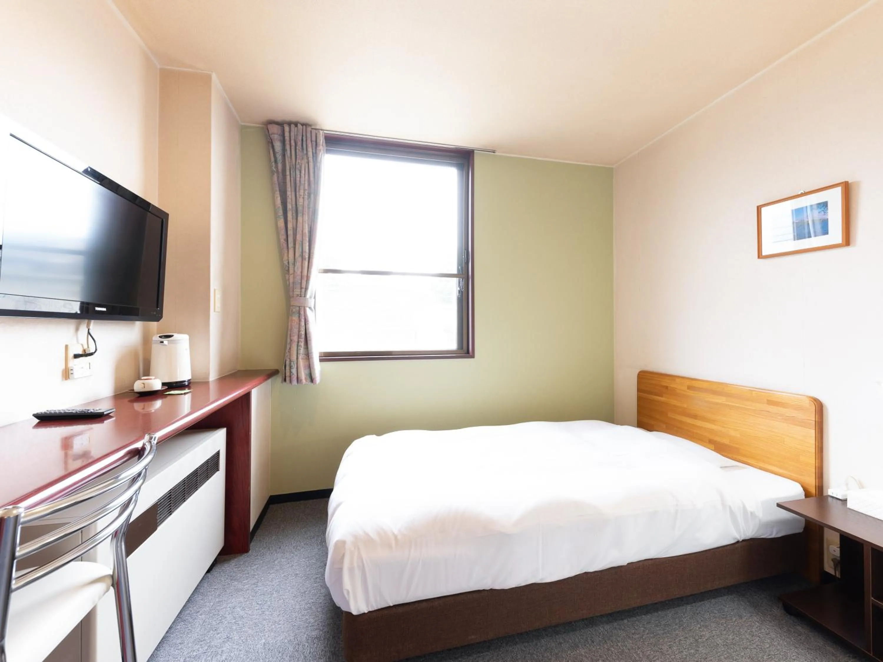 Bed in Tabist Travel Inn Shinshu Nakano