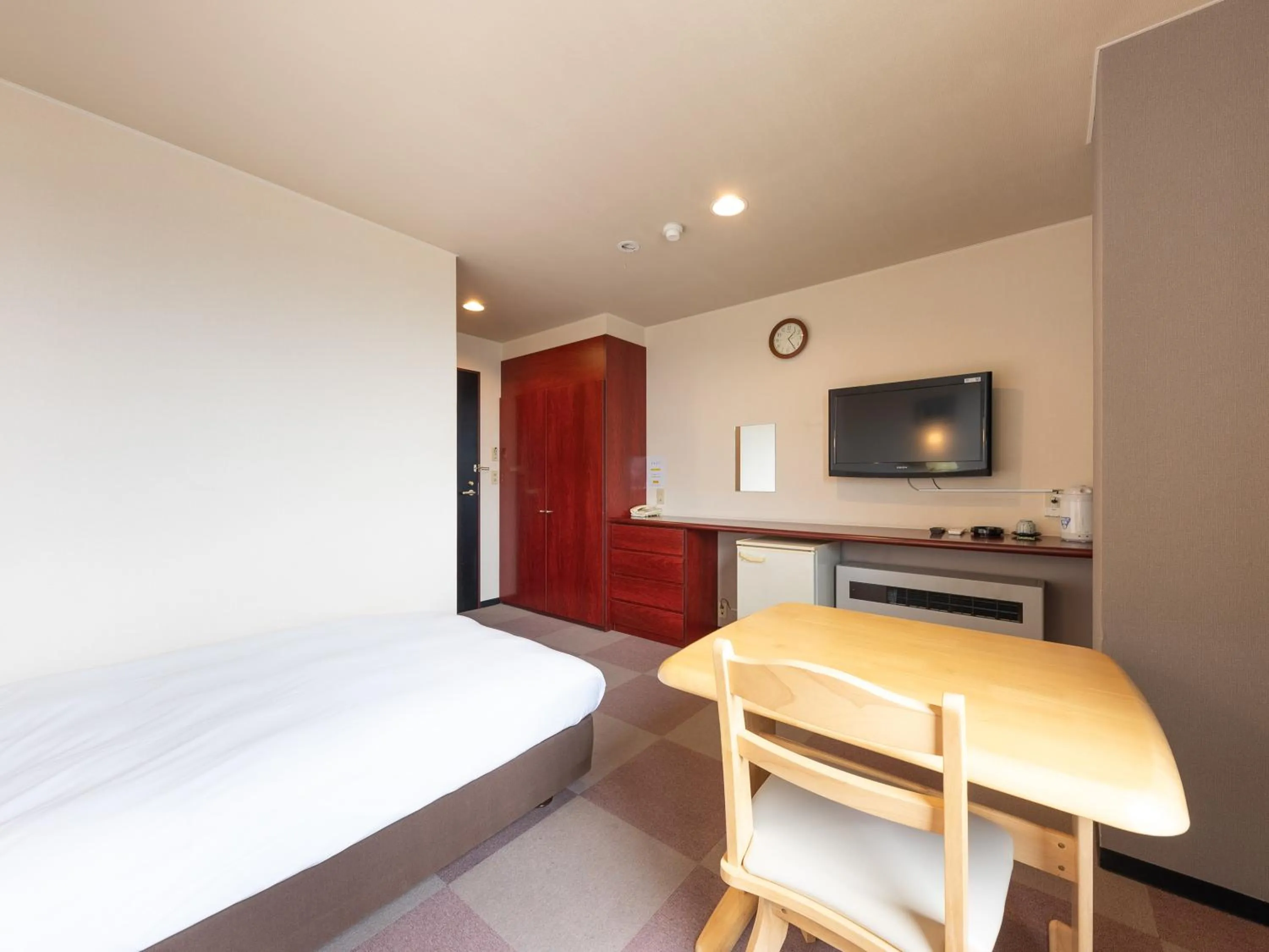 Bed in Tabist Travel Inn Shinshu Nakano