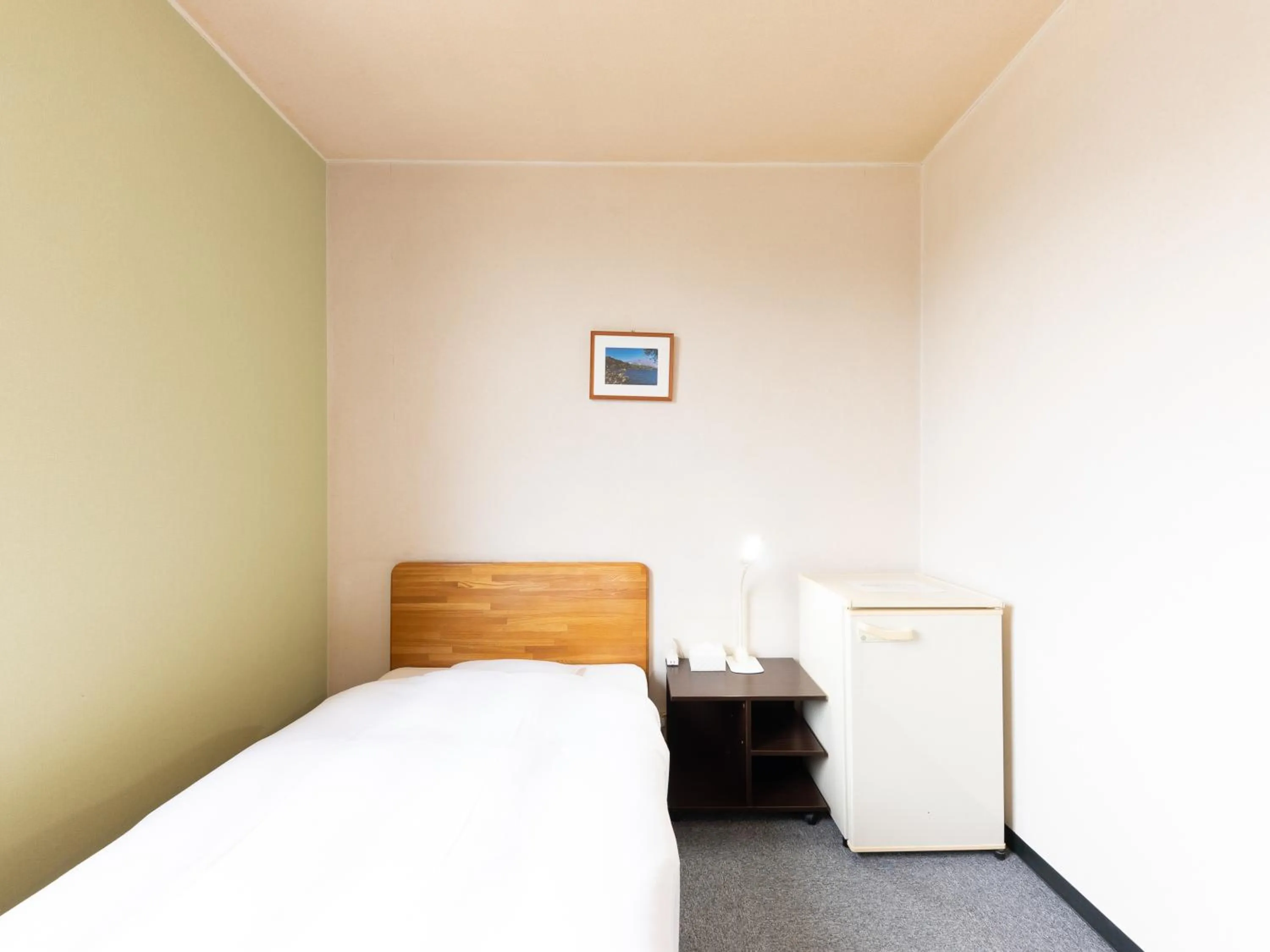 Bed in Tabist Travel Inn Shinshu Nakano