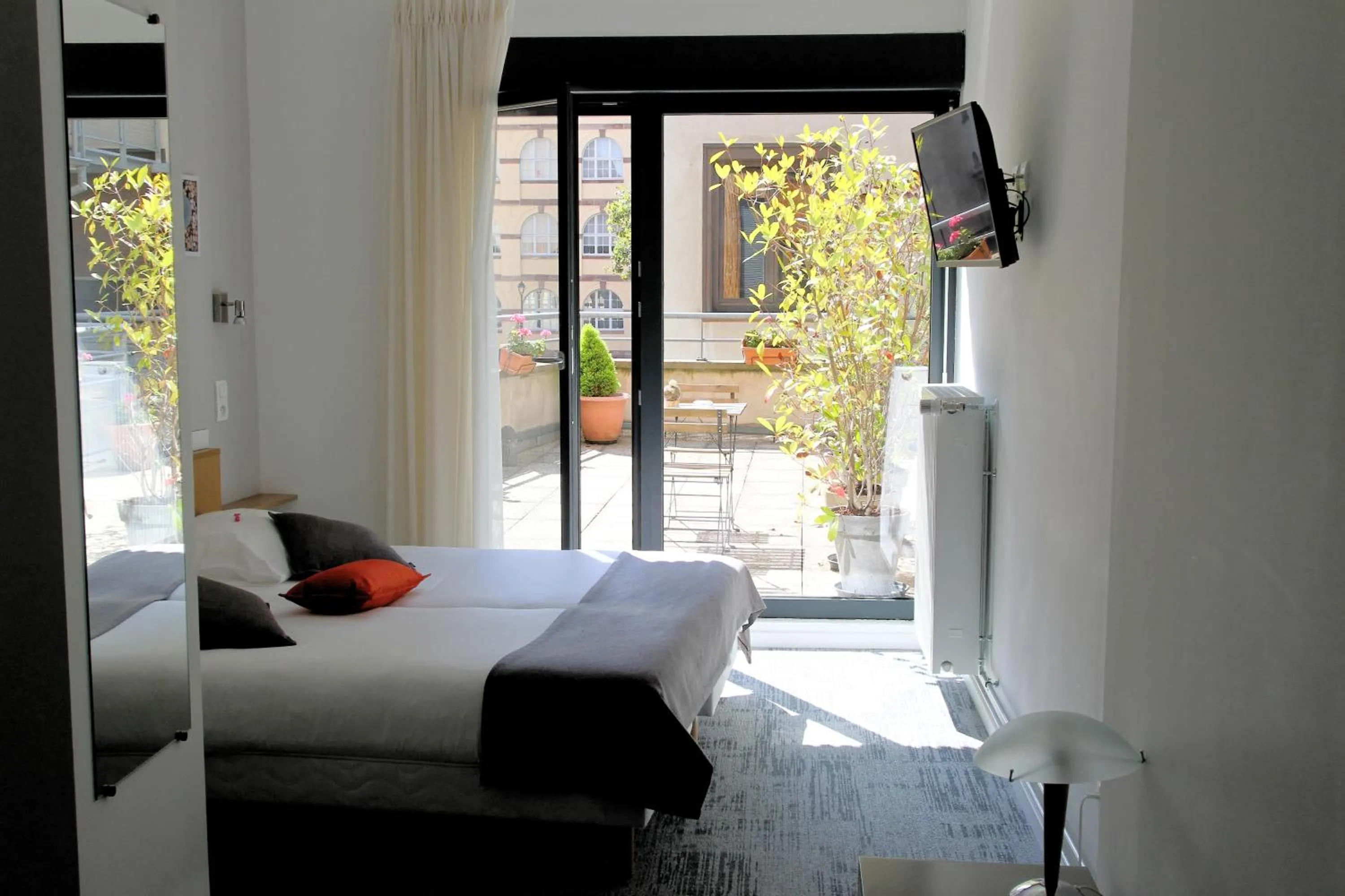 Bed in Hôtel De L'Ill