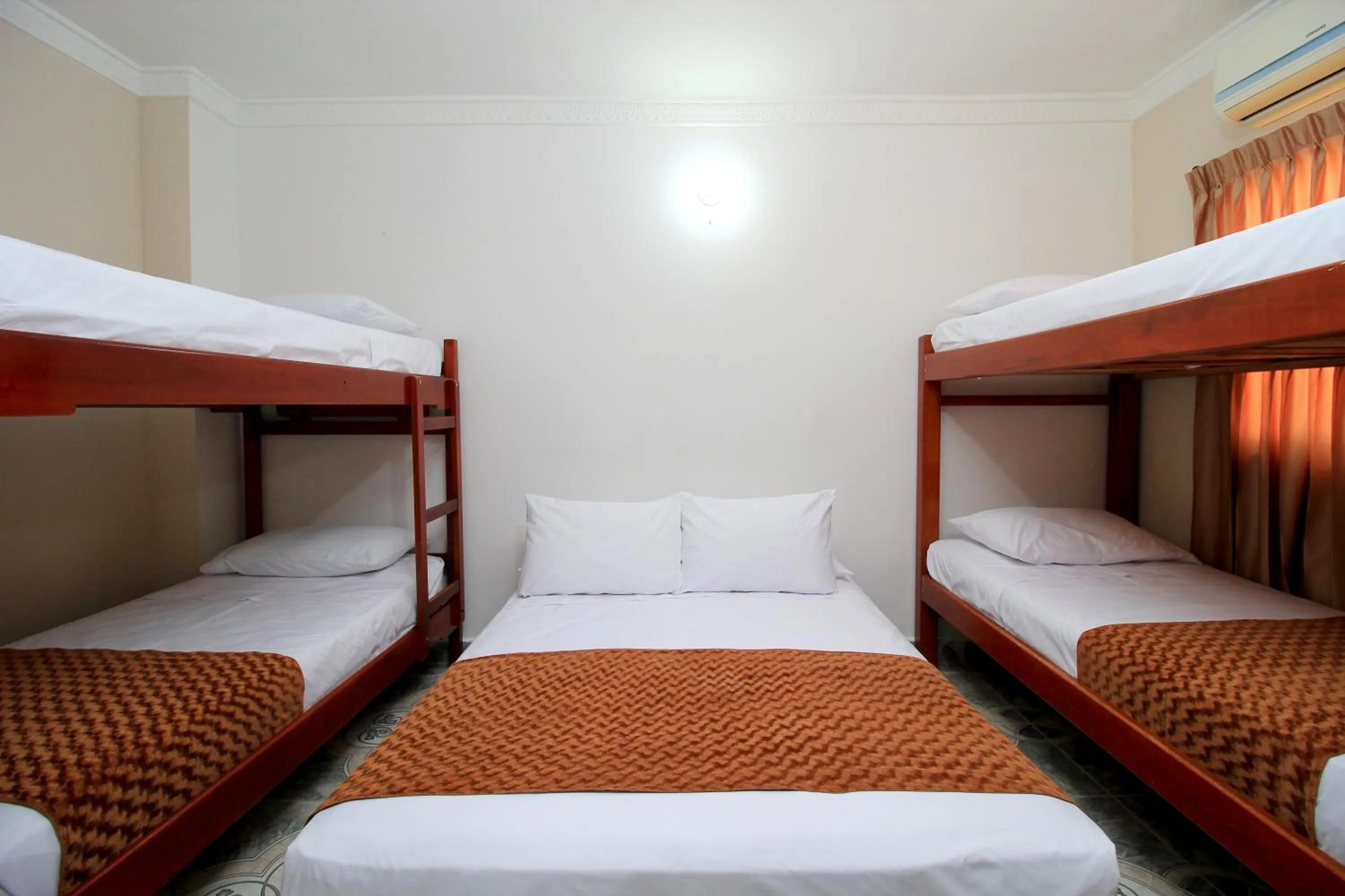 Bed in Hotel Rodadero Inn By GEH Suites