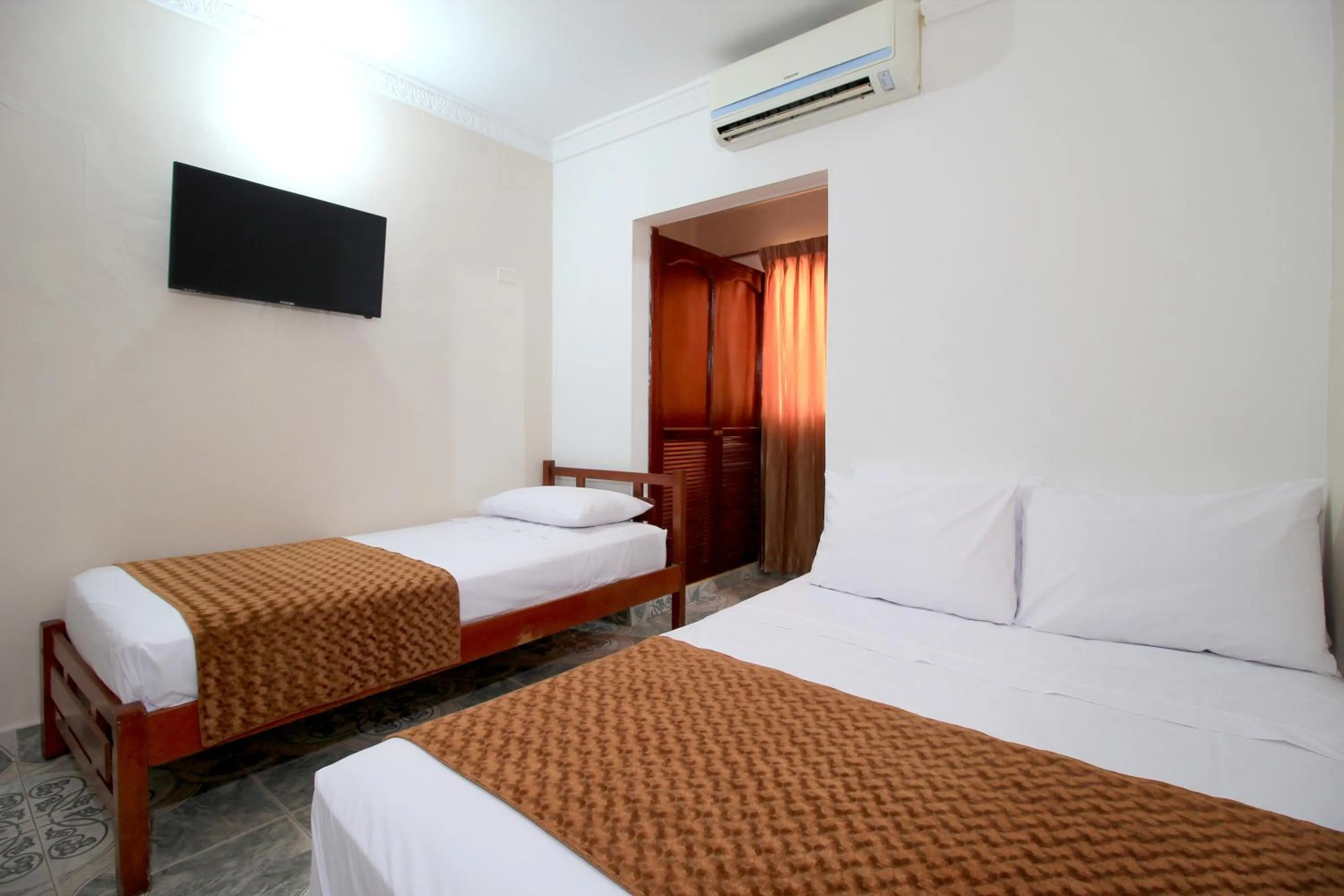 Bed in Hotel Rodadero Inn By GEH Suites