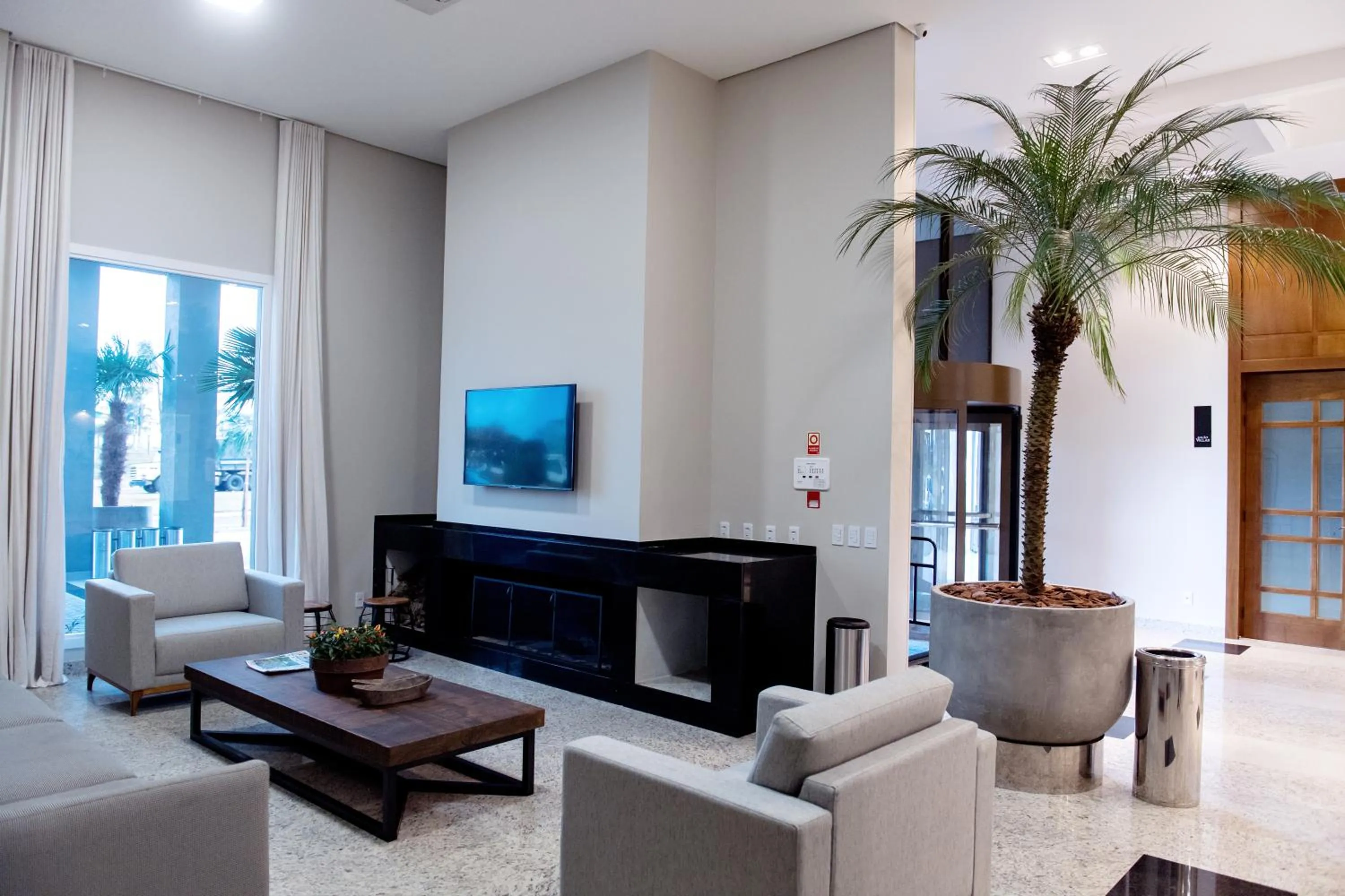 Communal lounge/ TV room in Villas Hotel