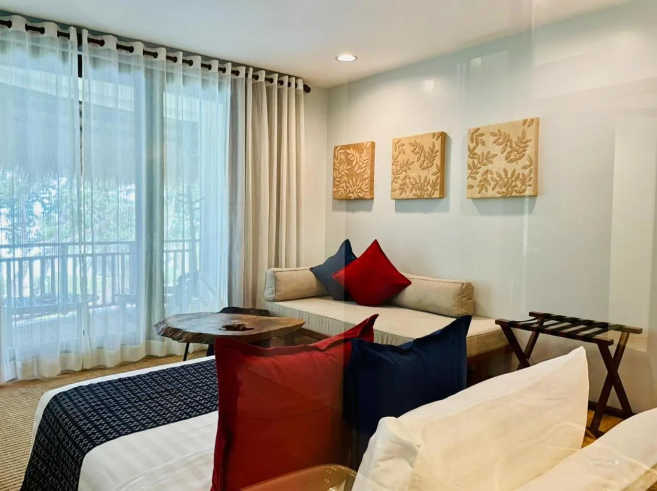 Seating area, Bed in Amun Ini Beach Resort & Spa