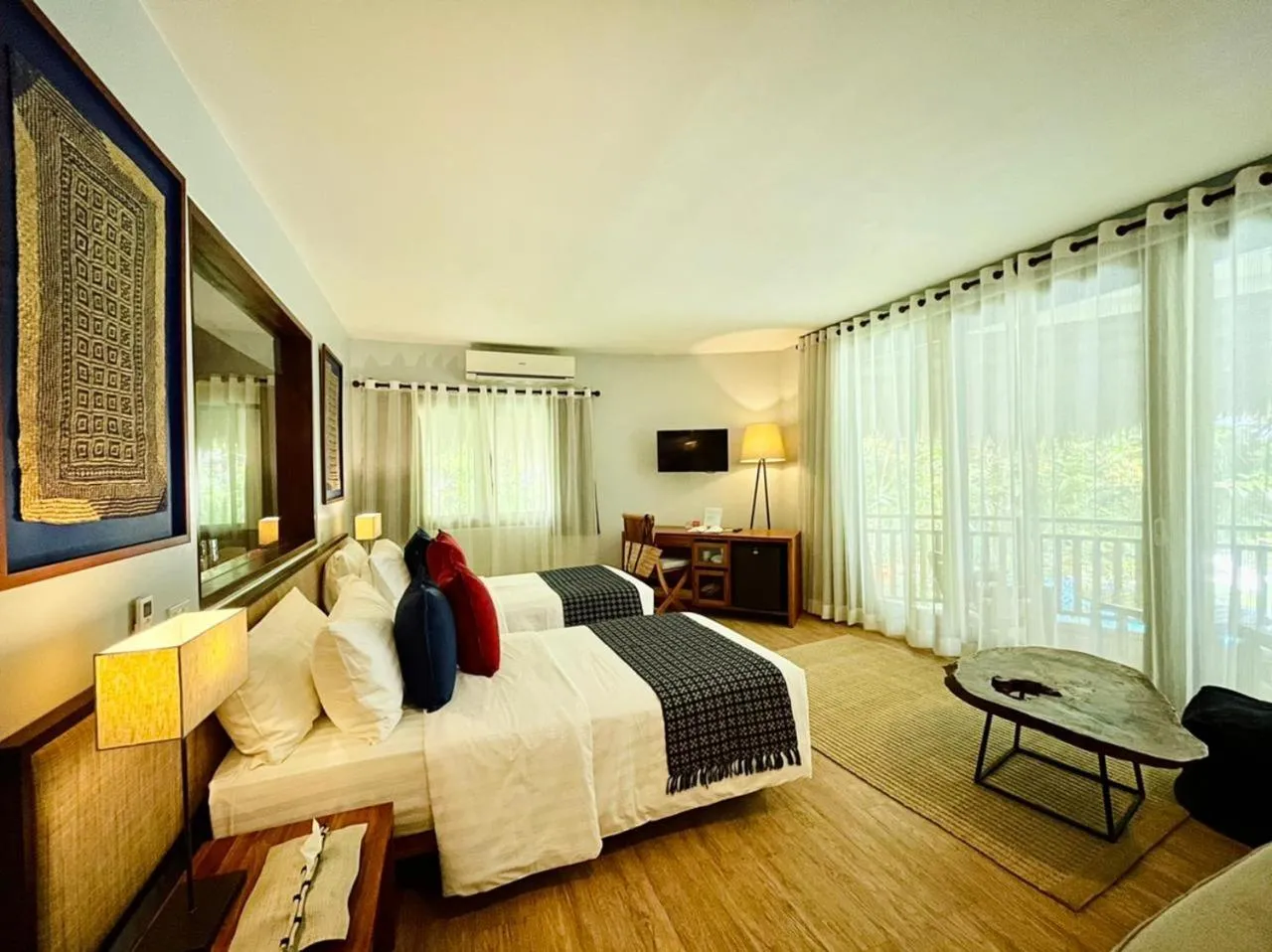 Photo of the whole room, Bed in Amun Ini Beach Resort & Spa