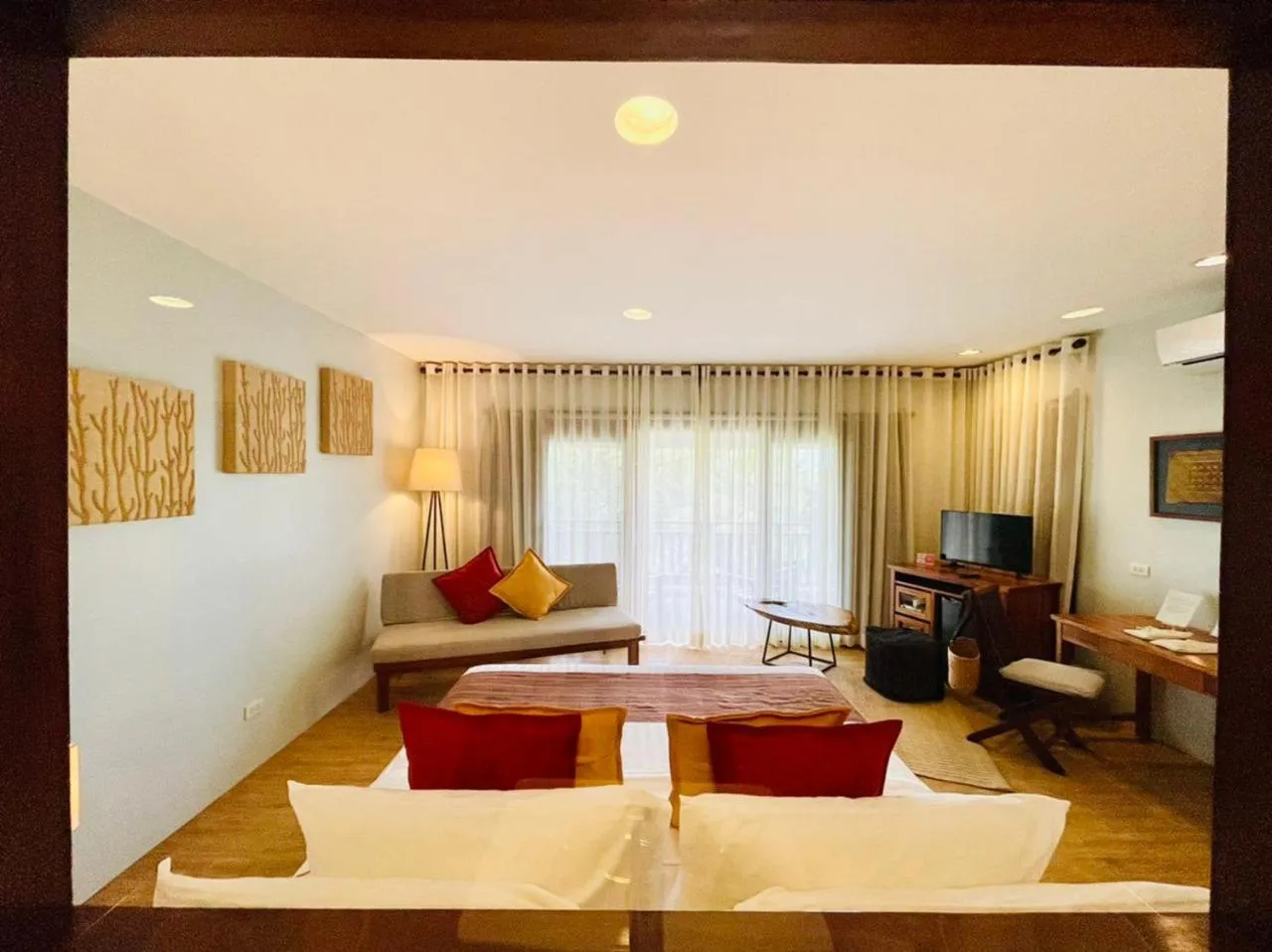 Photo of the whole room, Bed in Amun Ini Beach Resort & Spa