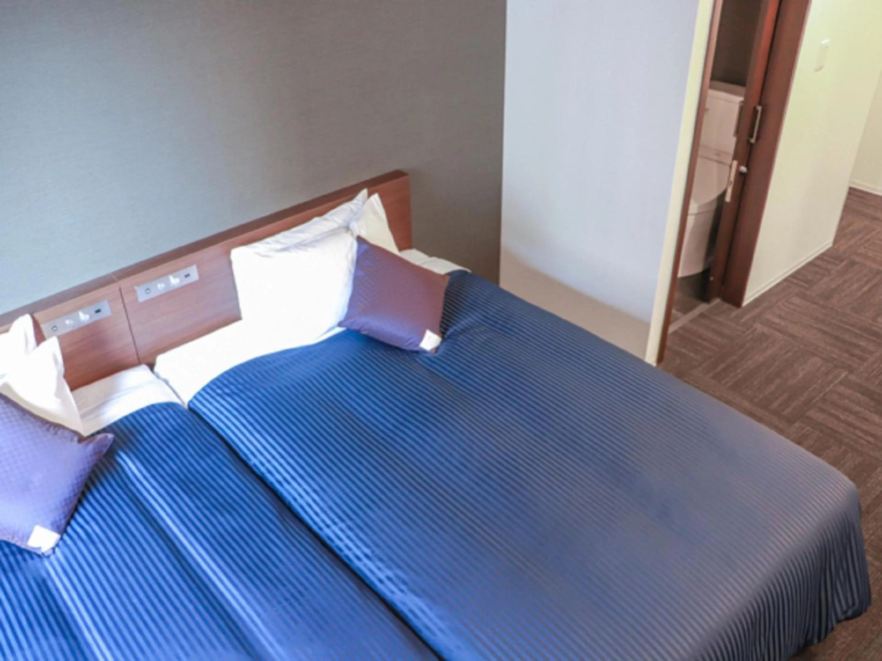 Bed in HOTEL LiVEMAX Chiba Minato Eki-mae