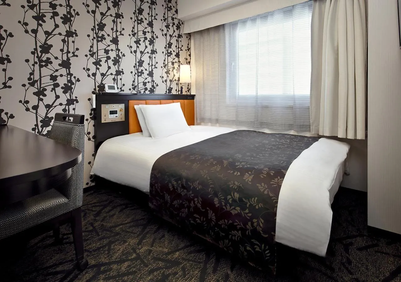 Bed in APA Hotel Saitama Higashimatsuyama Ekimae