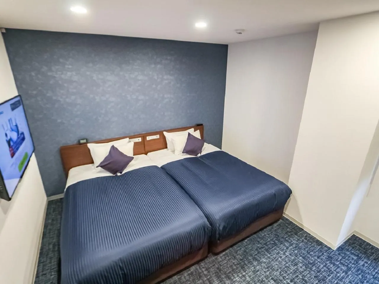 Bed in HOTEL LiVEMAX BUDGET Fuji Ekimae