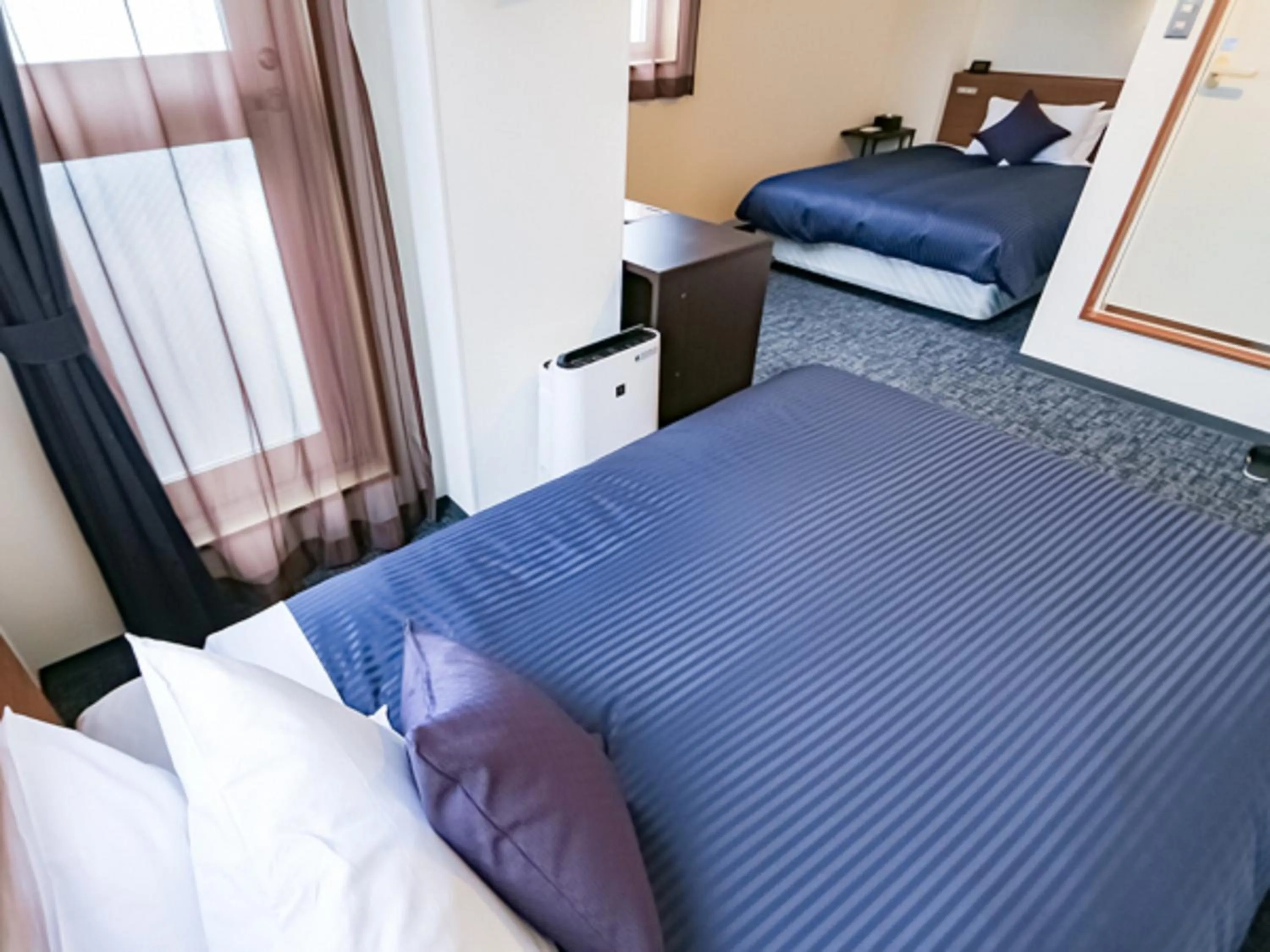 Bed in HOTEL LiVEMAX BUDGET Fuji Ekimae