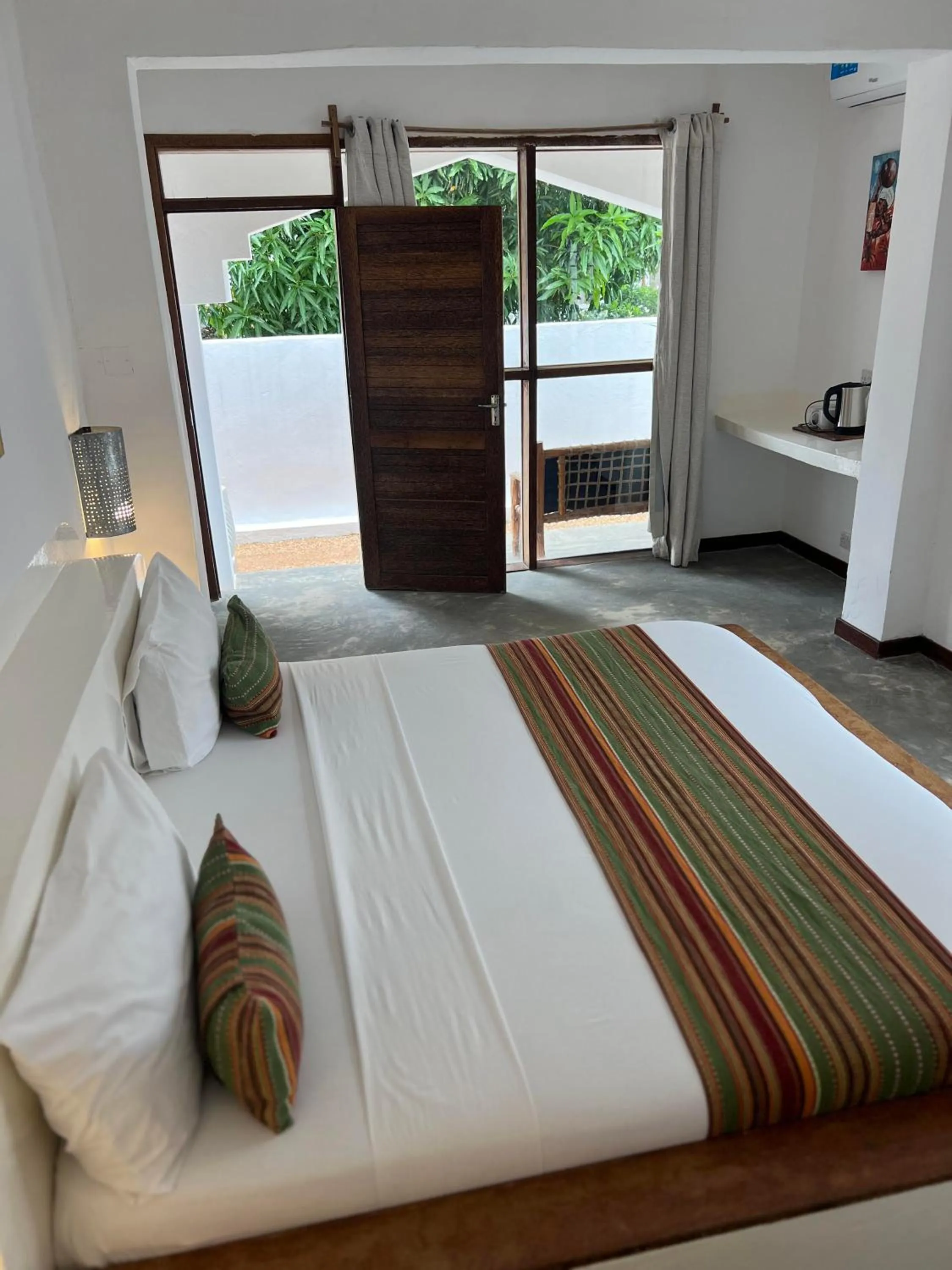 Photo of the whole room, Bed in Nungwi Getaway