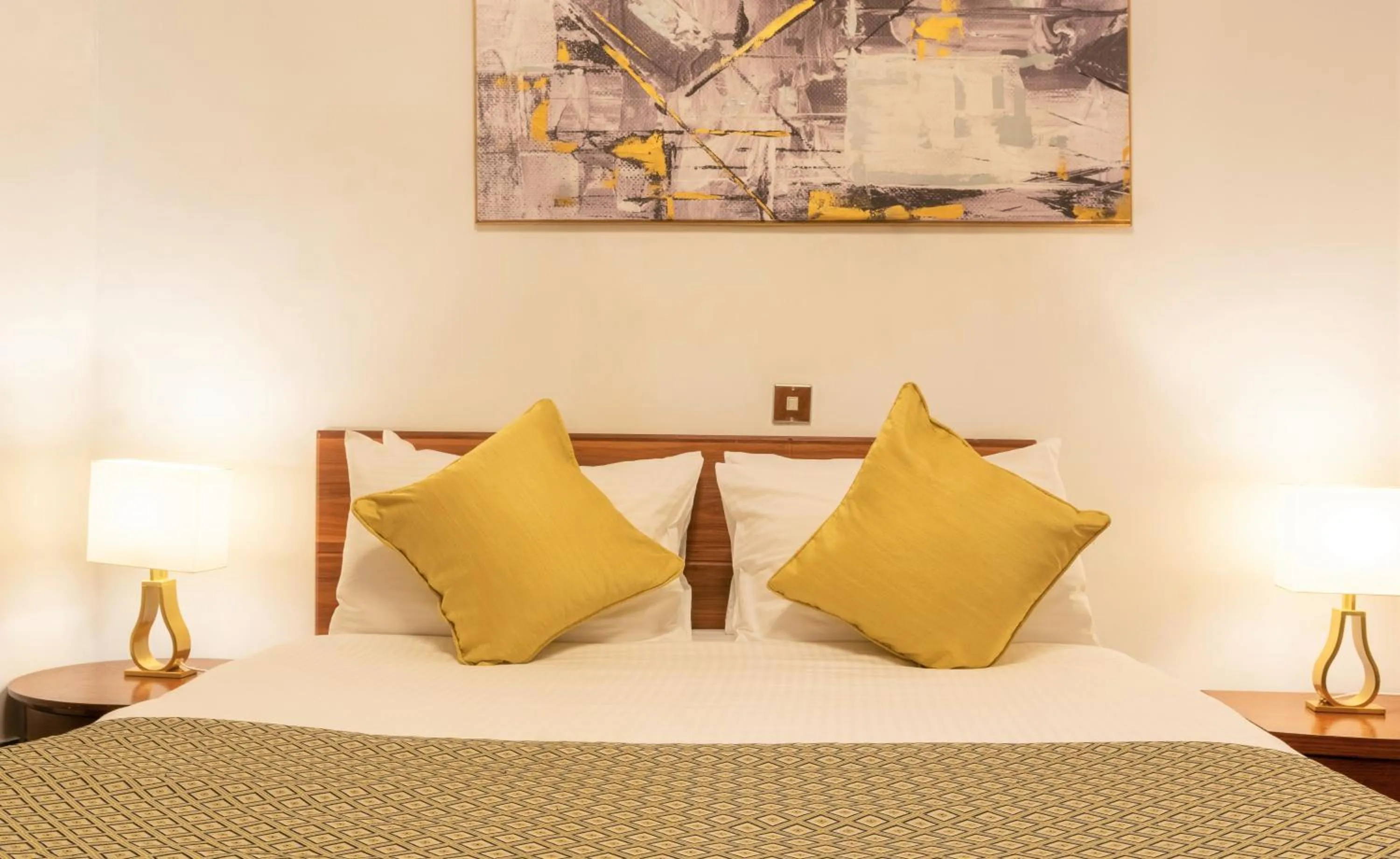 Bed in CySuites Apartment Hotel