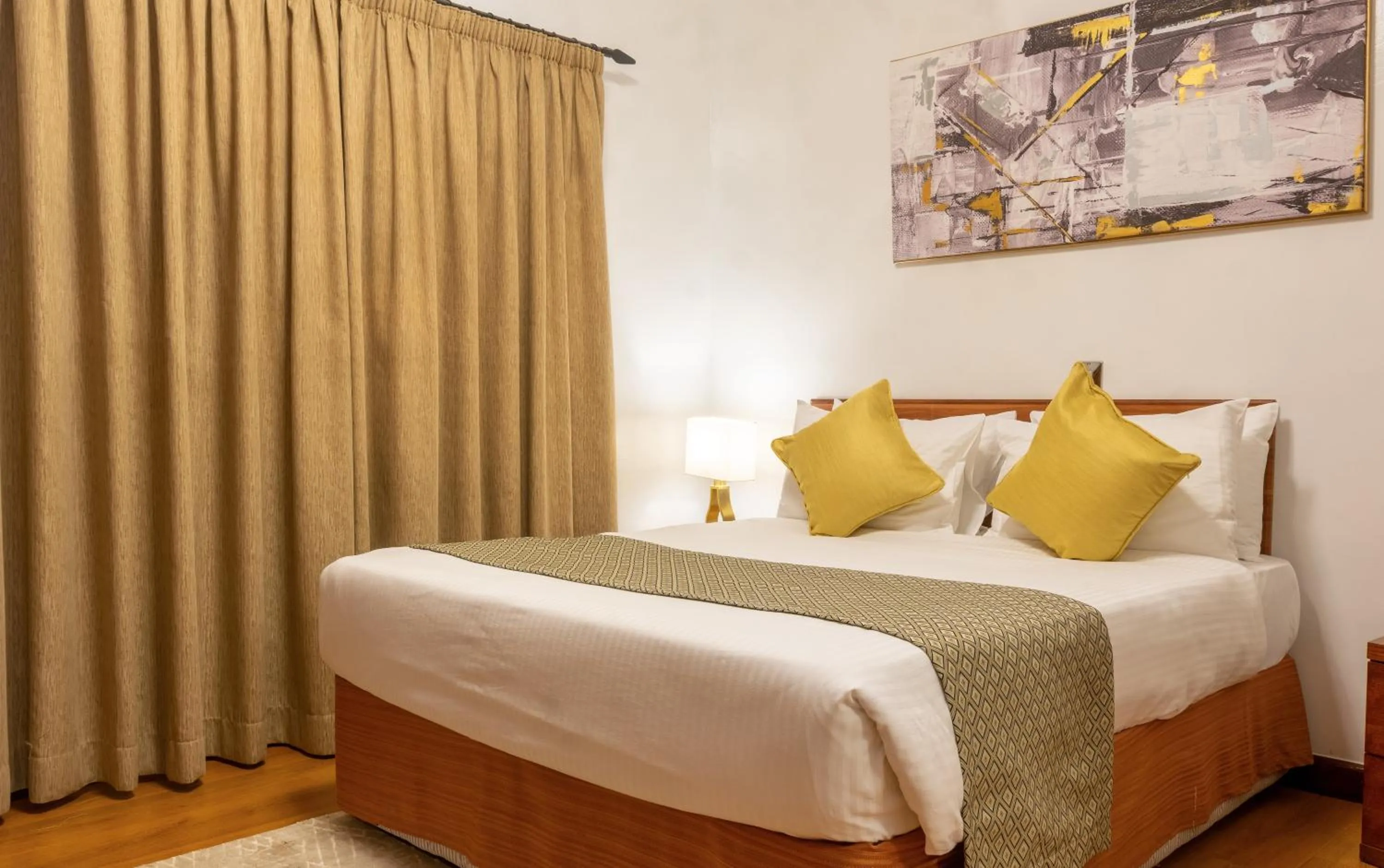 Bed in CySuites Apartment Hotel