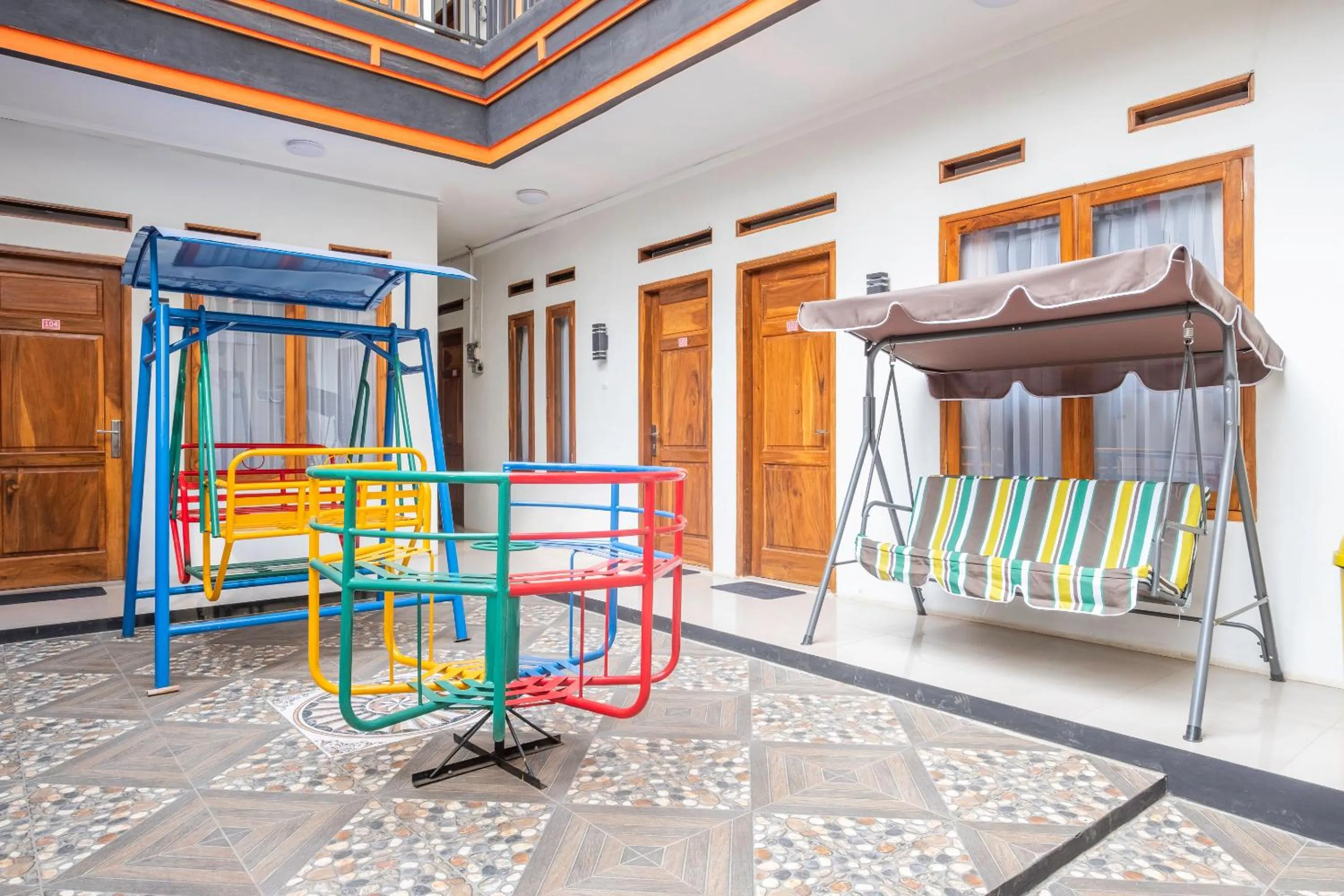 Children play ground in Urbanview Hotel One Family Maribaya by RedDoorz