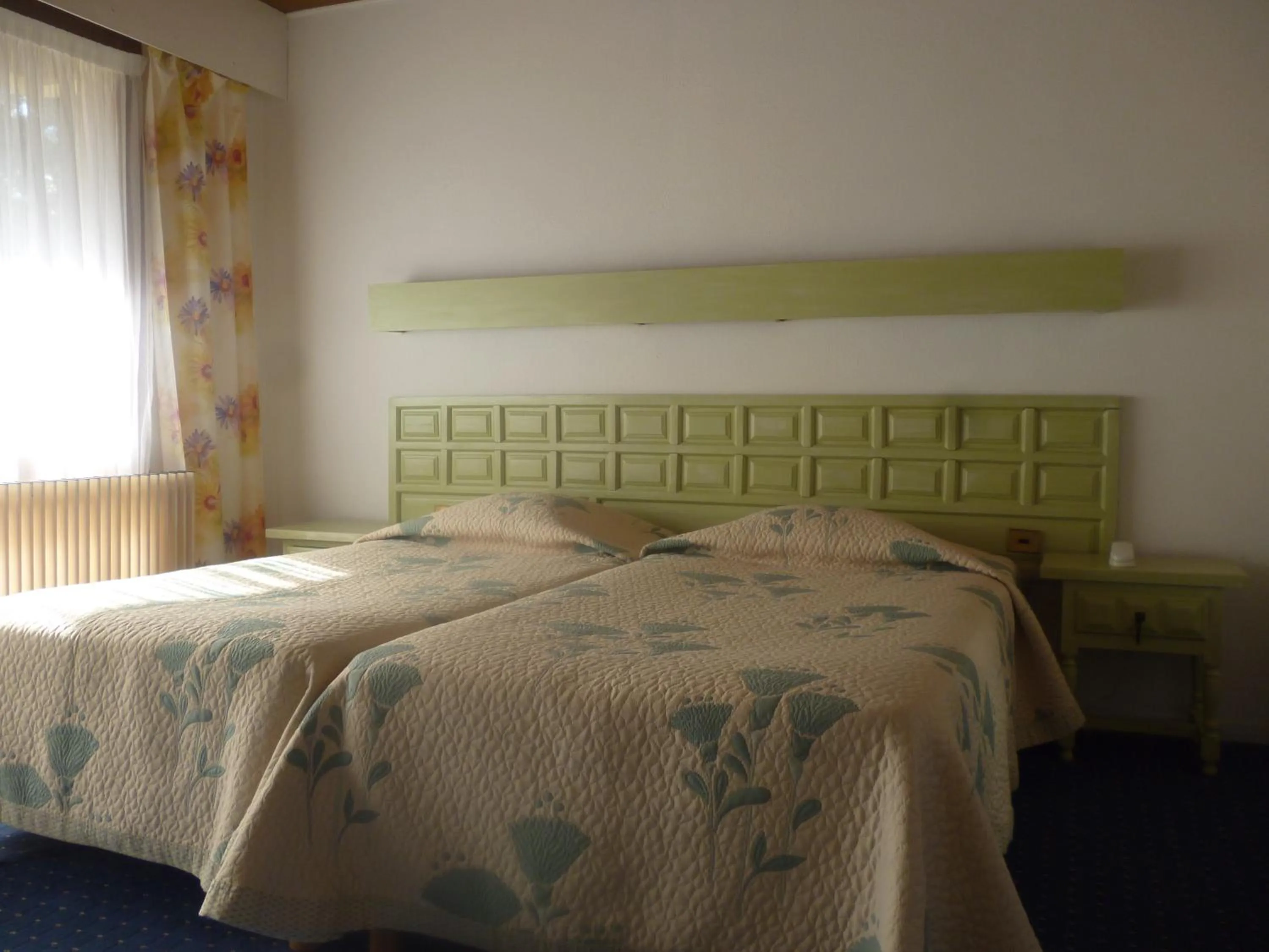 Bed in Hotel Le Mas Fleuri