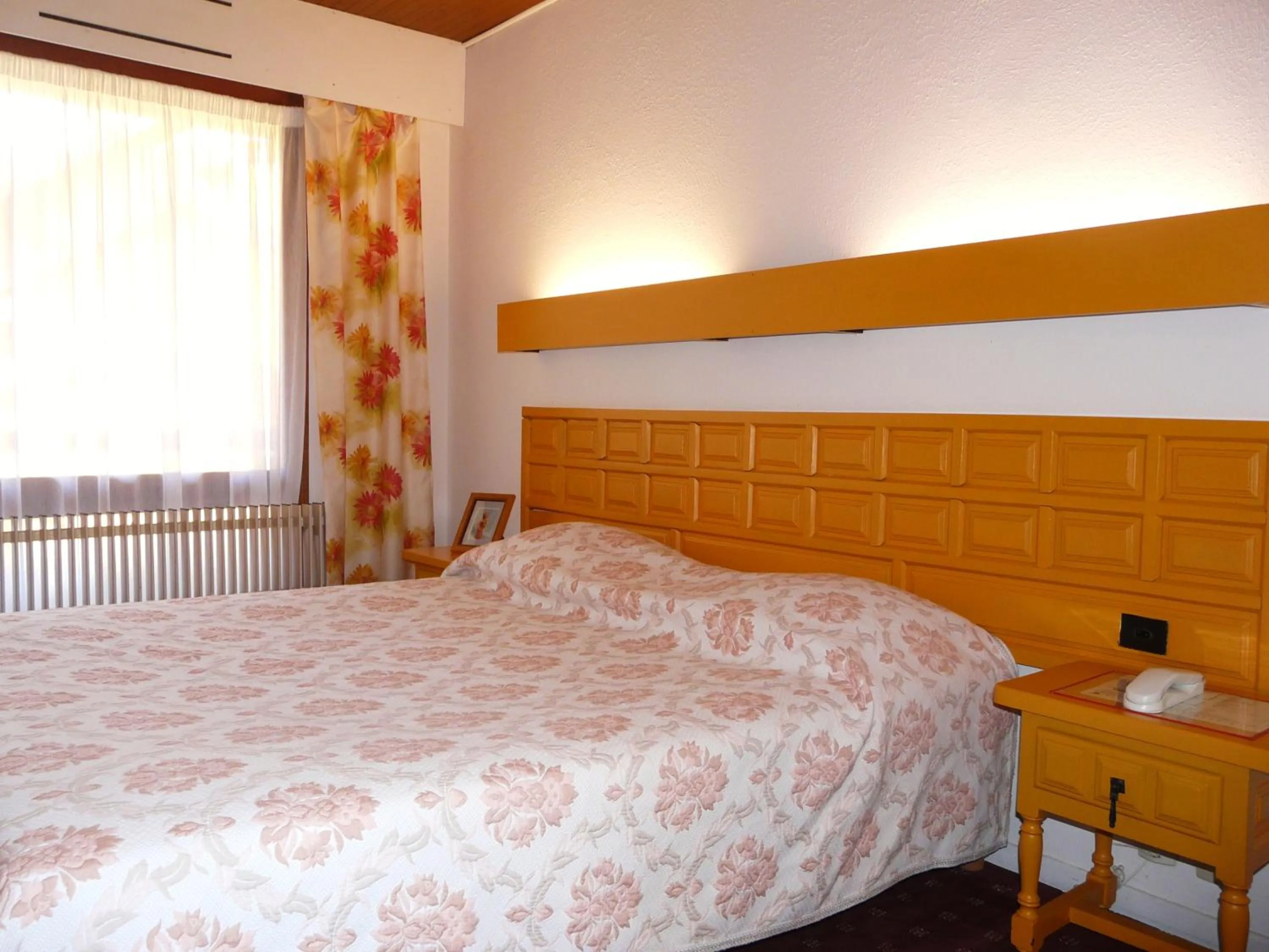 Bed in Hotel Le Mas Fleuri