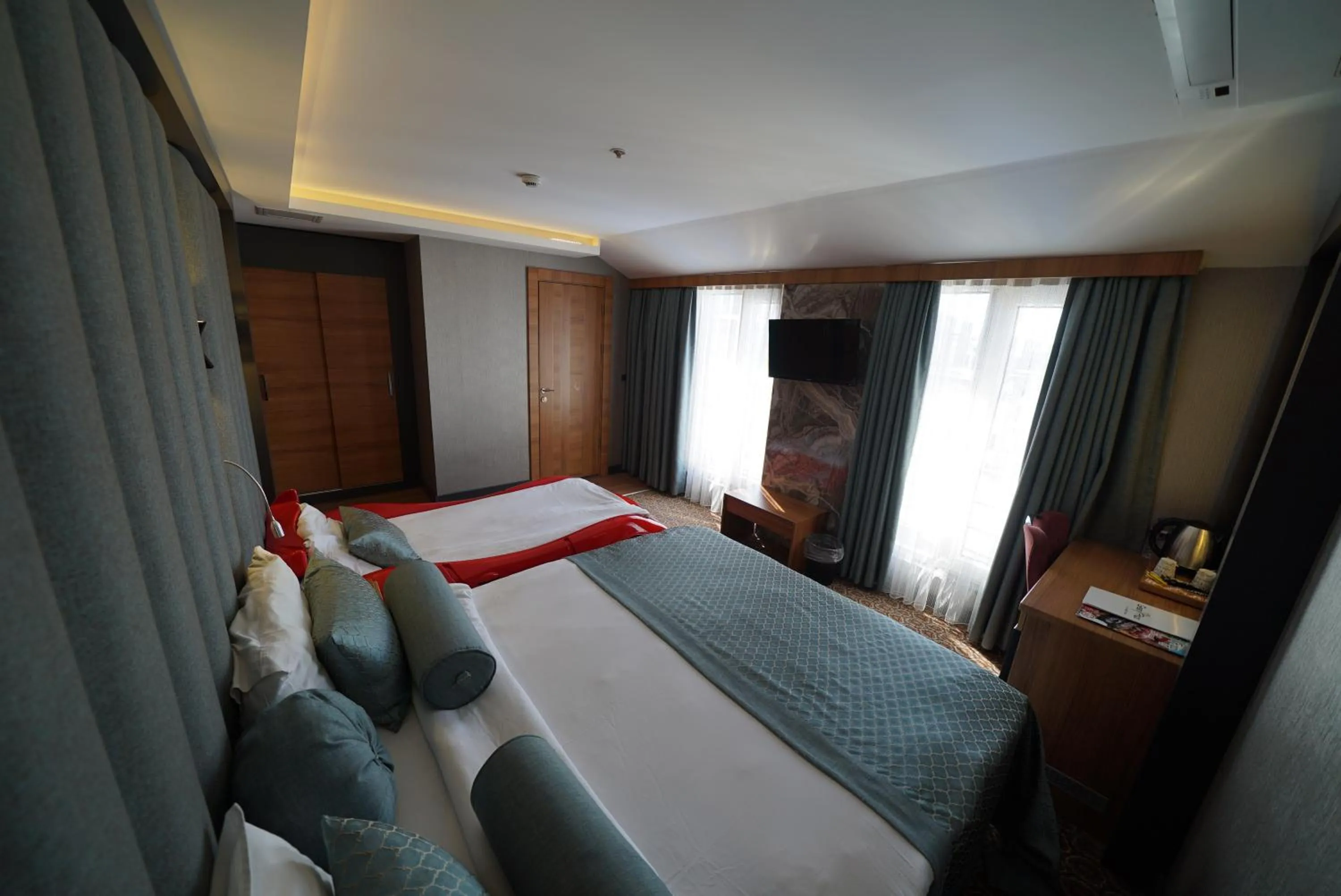 Bed in Green Prusa Hotel