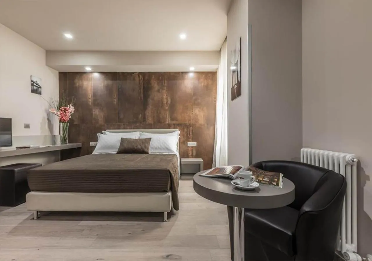 Bed in Astoria Deluxe rooms