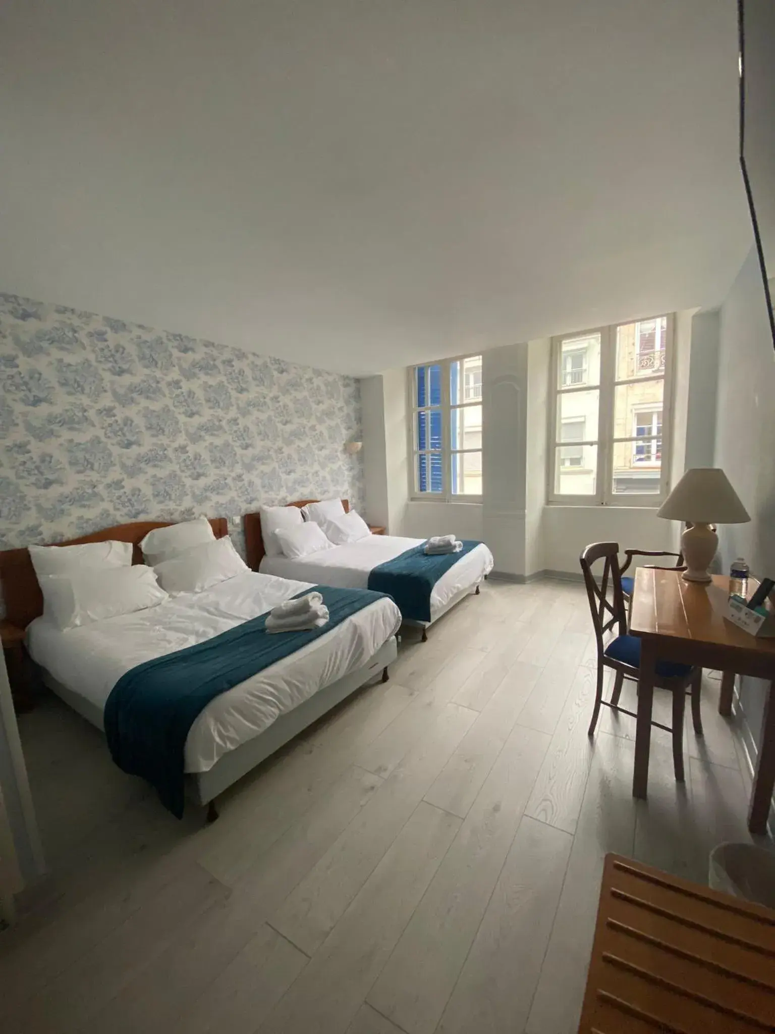 Quadruple Room in Logis Grand Hôtel De L'Europe Quadruple Room in Logis Grand Hôtel De L'Europe