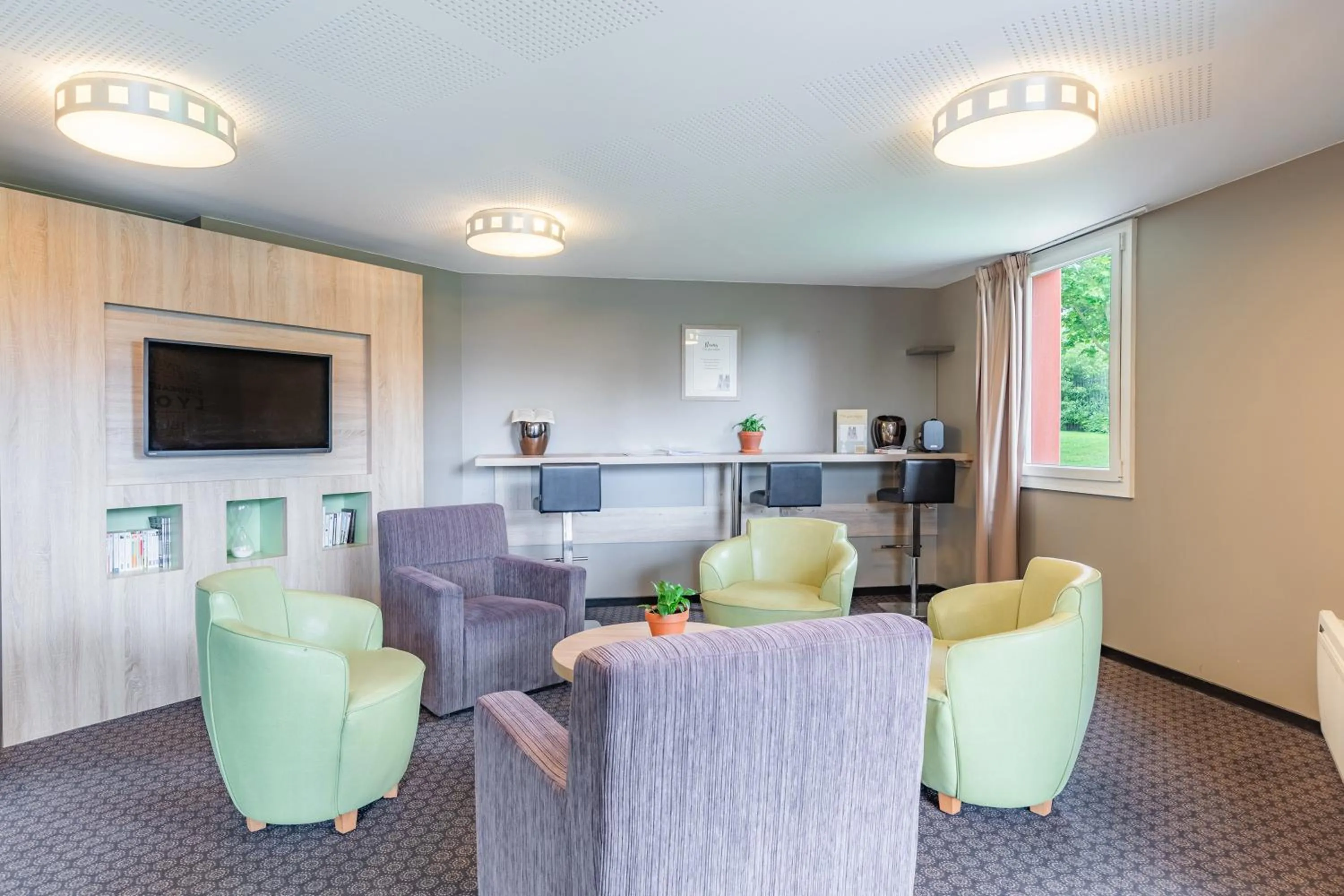 Communal lounge/ TV room in Appart'City Classic Reims Parc des Expositions