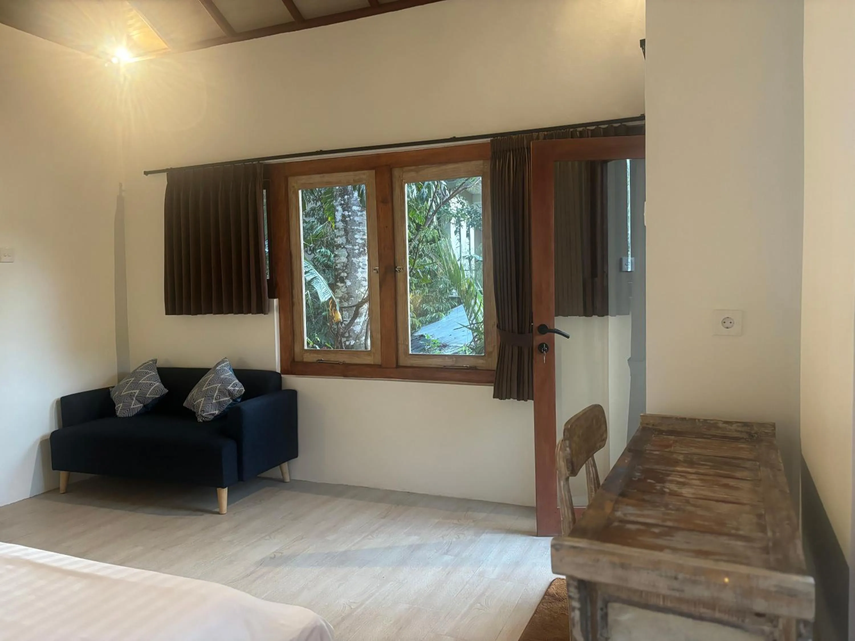 Seating area, Bed in Gumi Ayu EcoStay