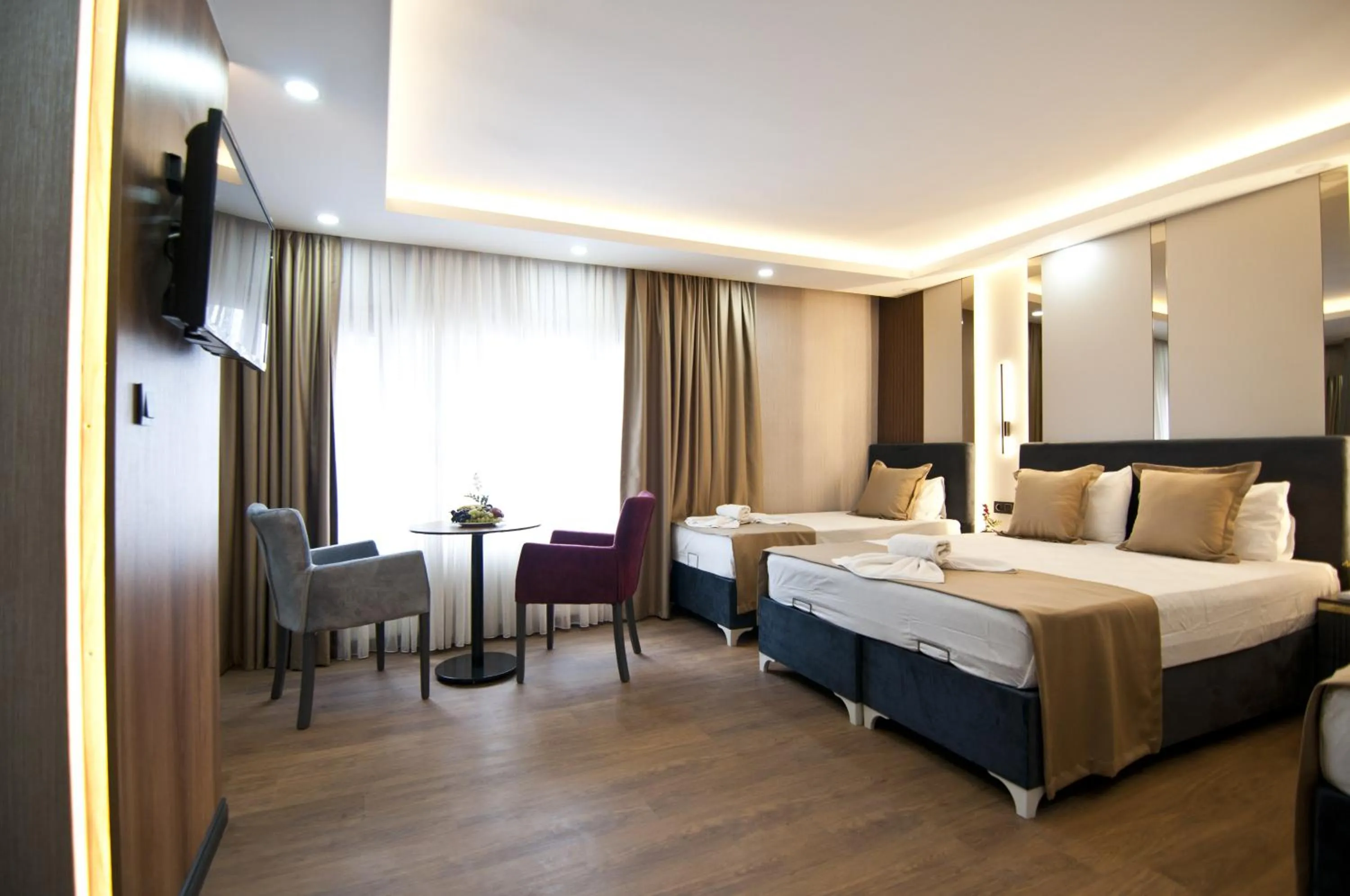 Photo of the whole room, Bed in Grand Bagoz Hotel