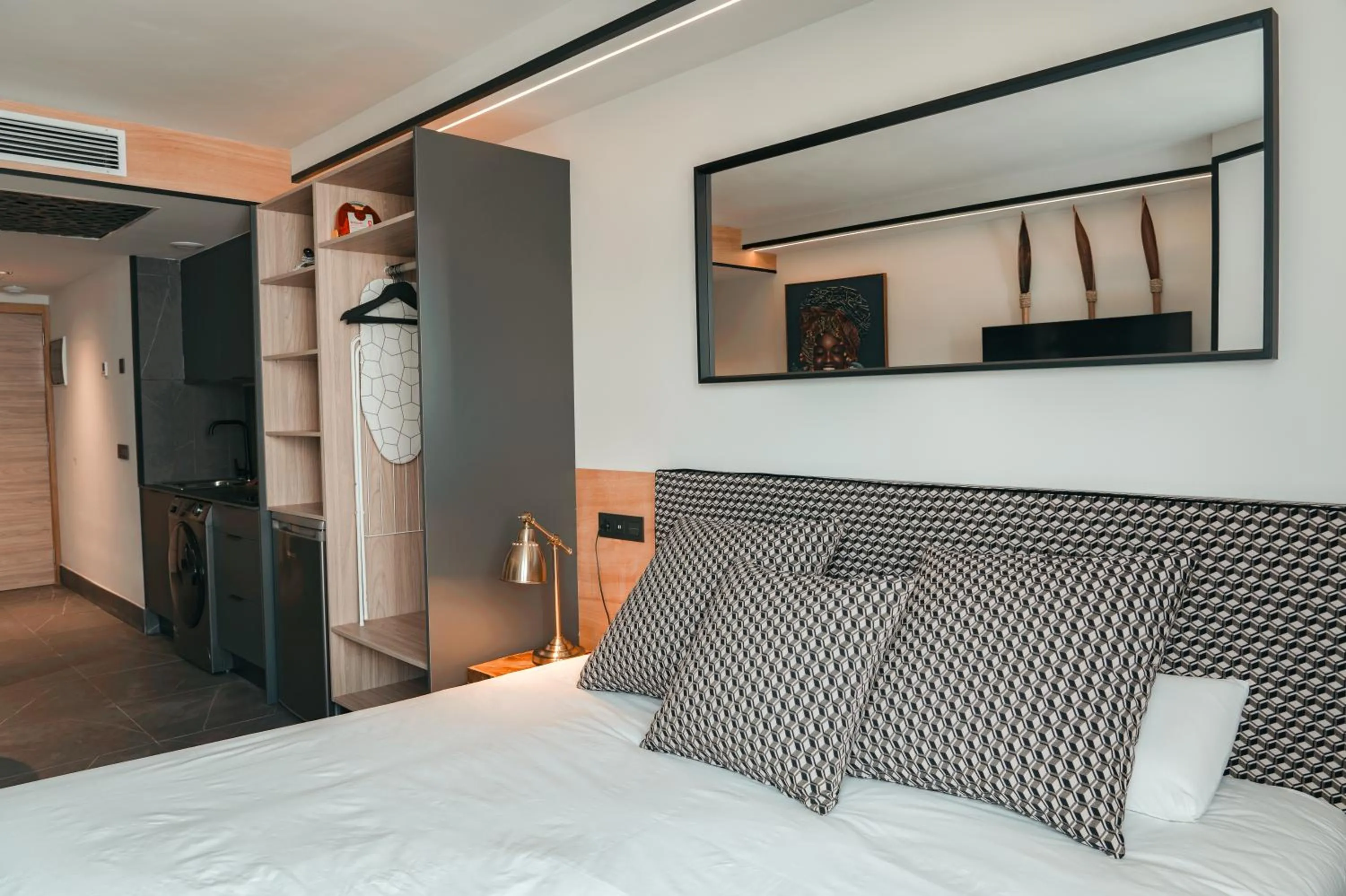 Photo of the whole room, Bed in Poem Suites, Las Canteras