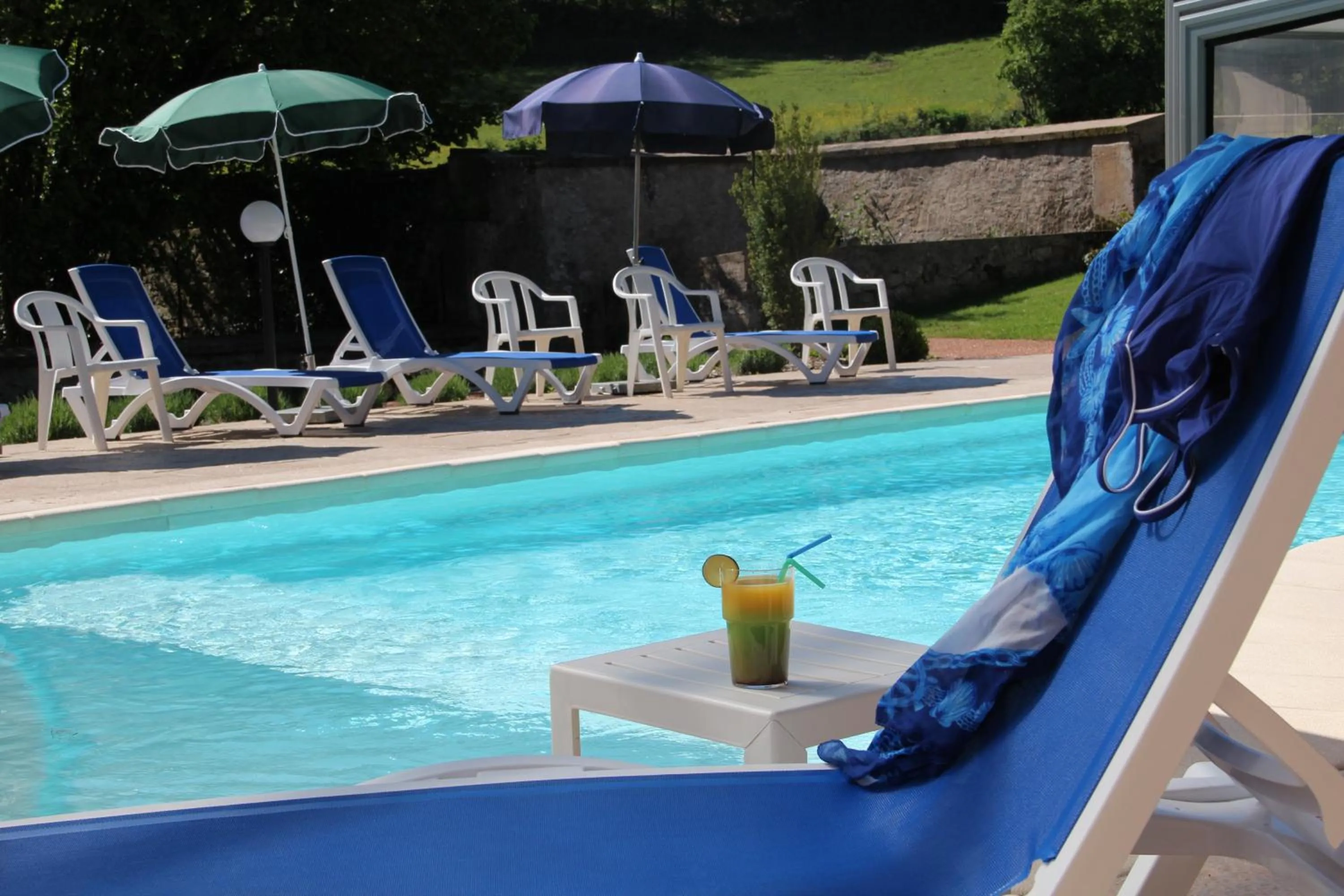 Swimming pool in Logis Des Trois Maures