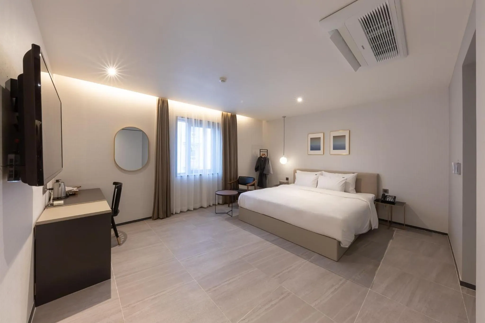 Bed in Brown-Dot Hotel Dongchon Amusement Park