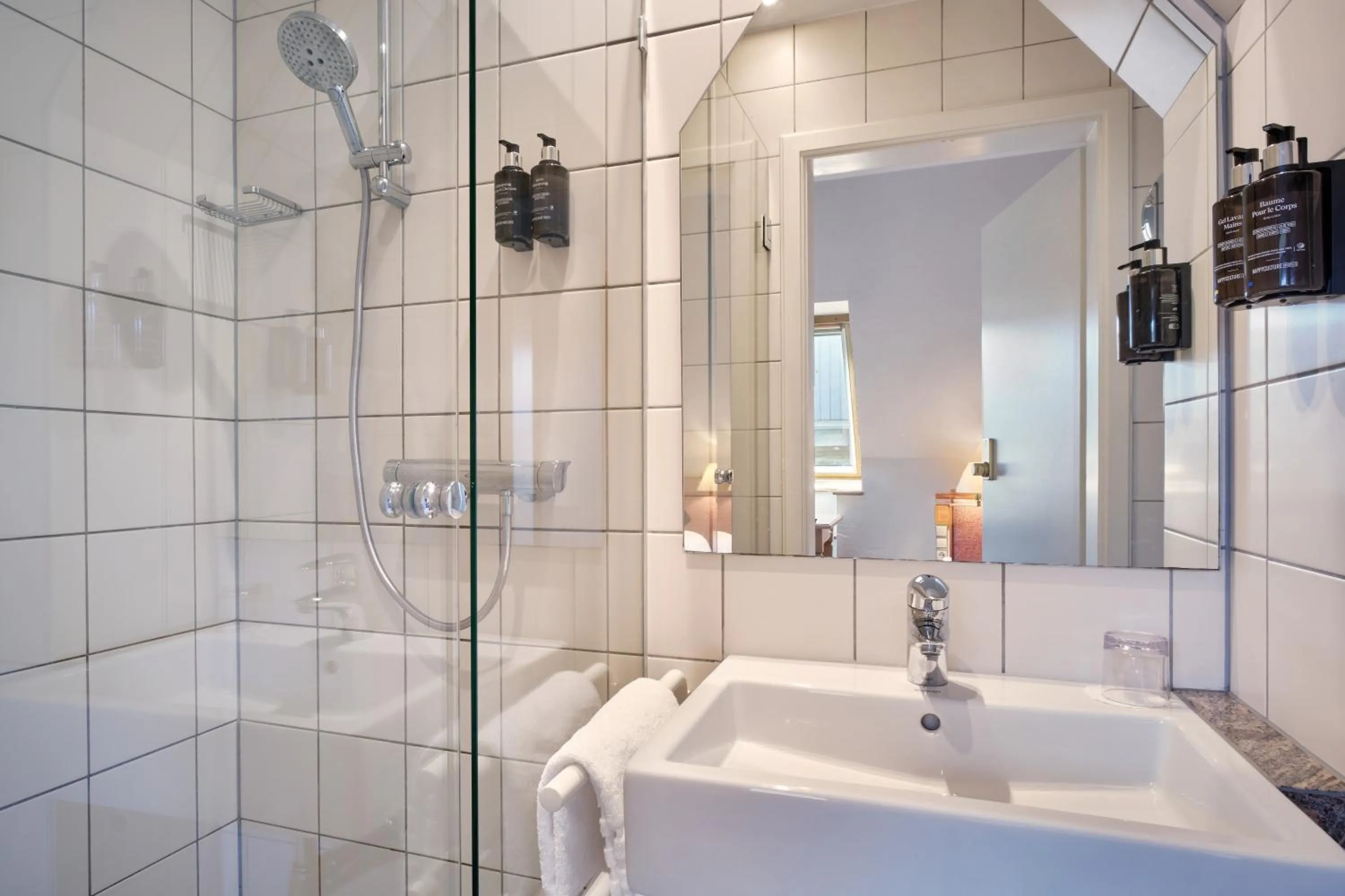 Bathroom in Hotel & Spa A la cour d'Alsace by HappyCulture