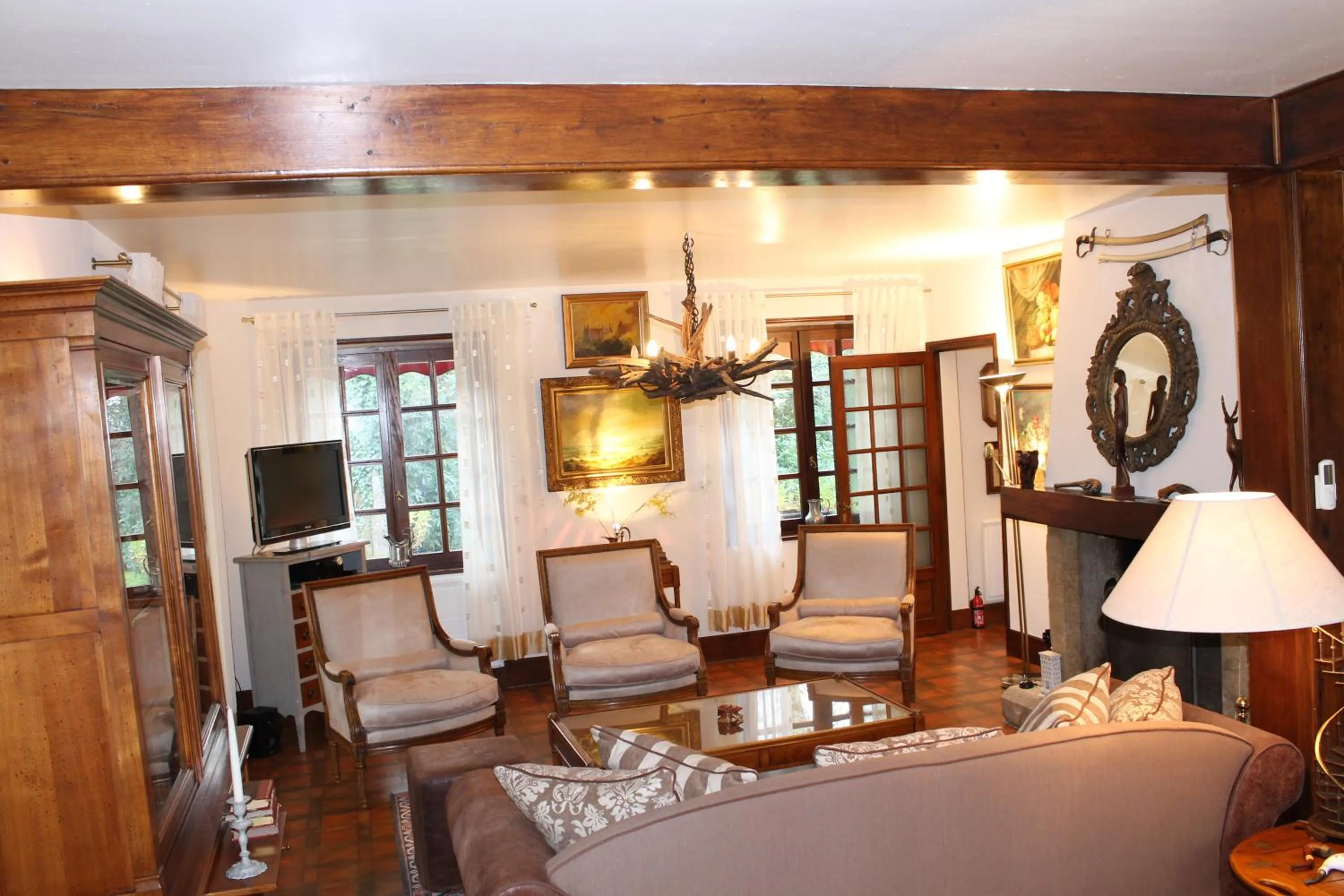 Communal lounge/ TV room in Chambres d'hôtes La Brillève