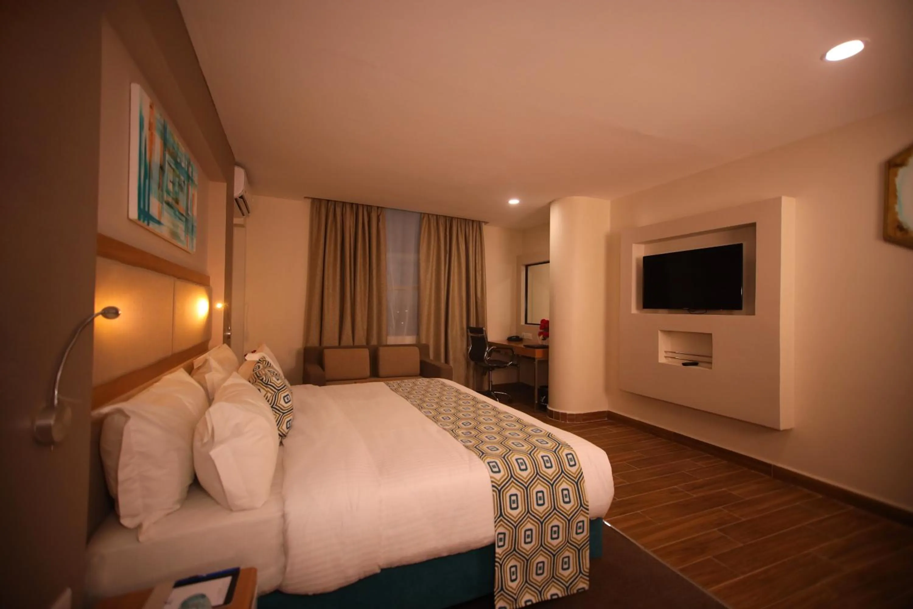 Communal lounge/ TV room, Bed in PrideInn Plaza Nairobi Airport