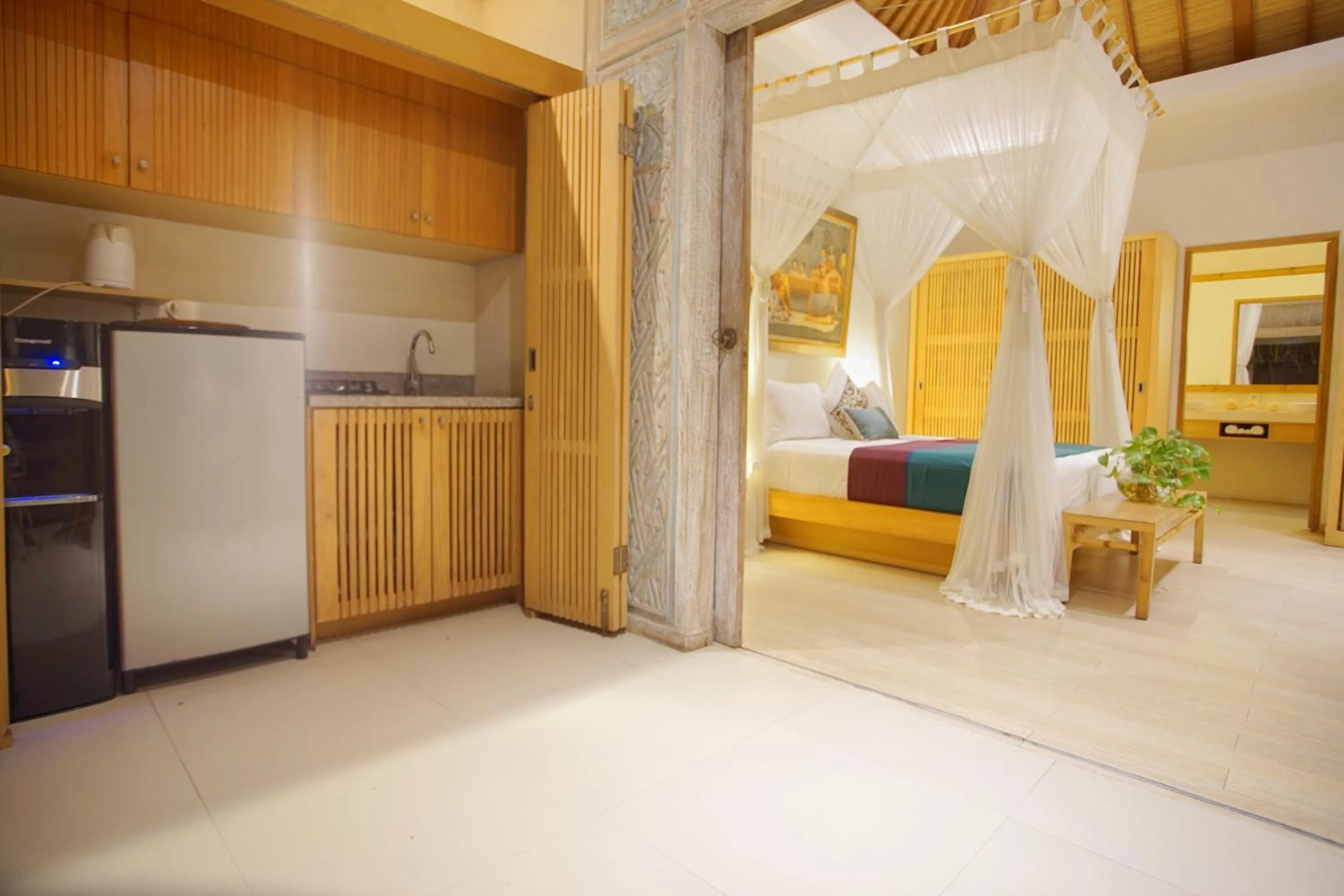 Kitchen or kitchenette, Bed in Villa Bali Asri Batubelig