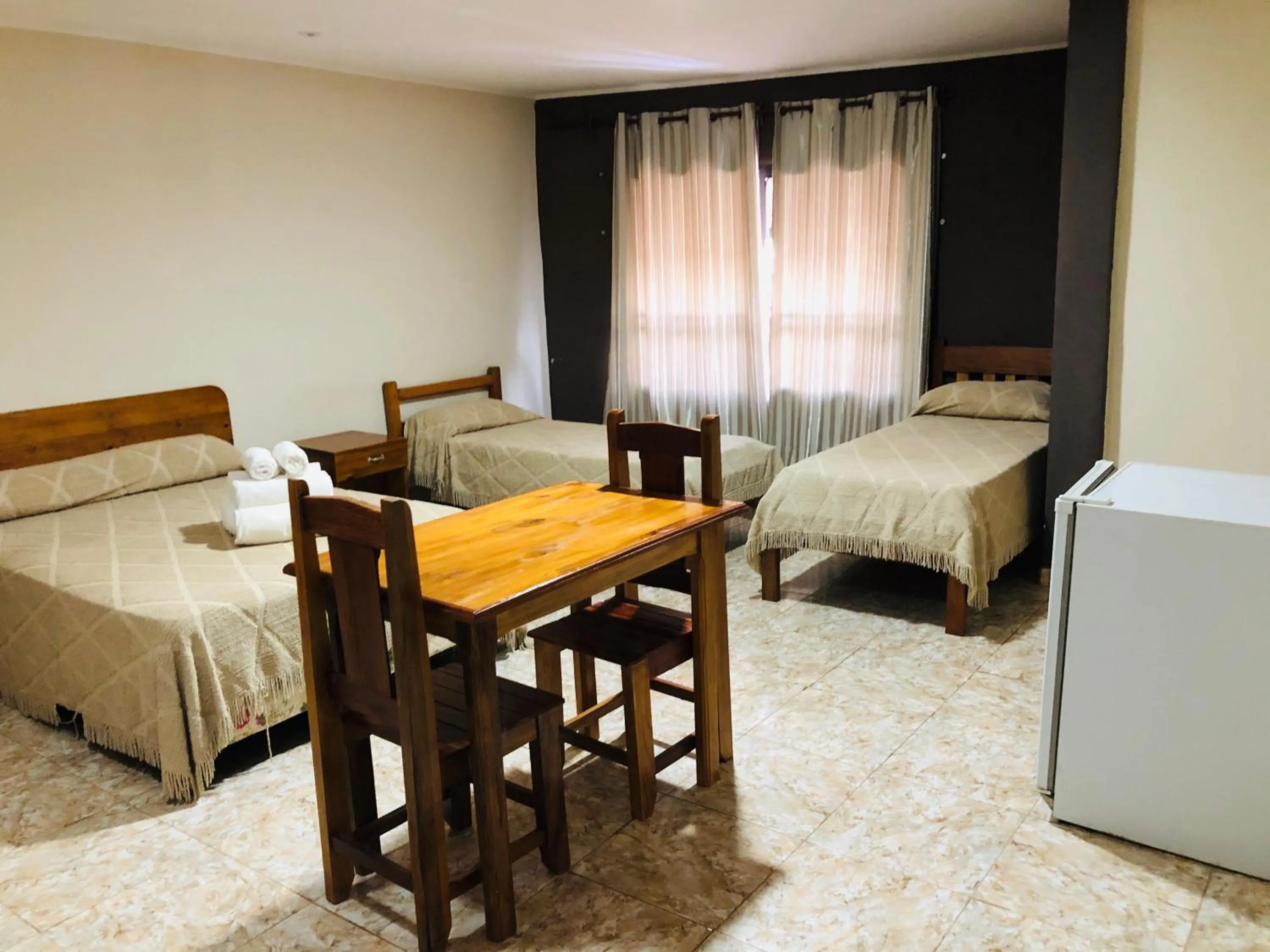 Bed in La Familia Hotel