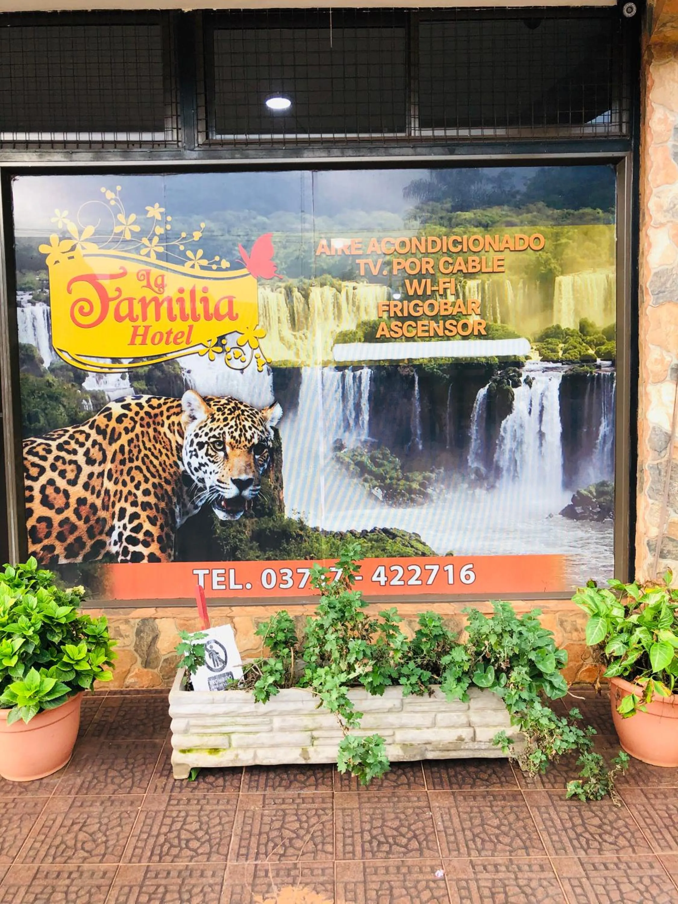 Property logo or sign in La Familia Hotel