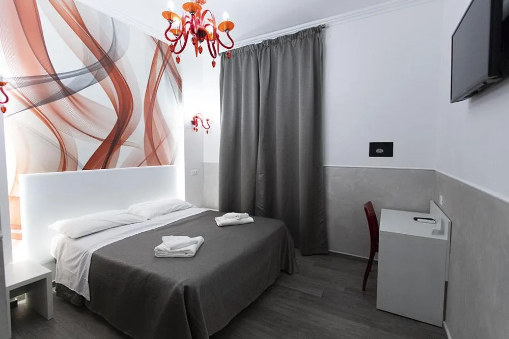 Bed in Rubino Guest House